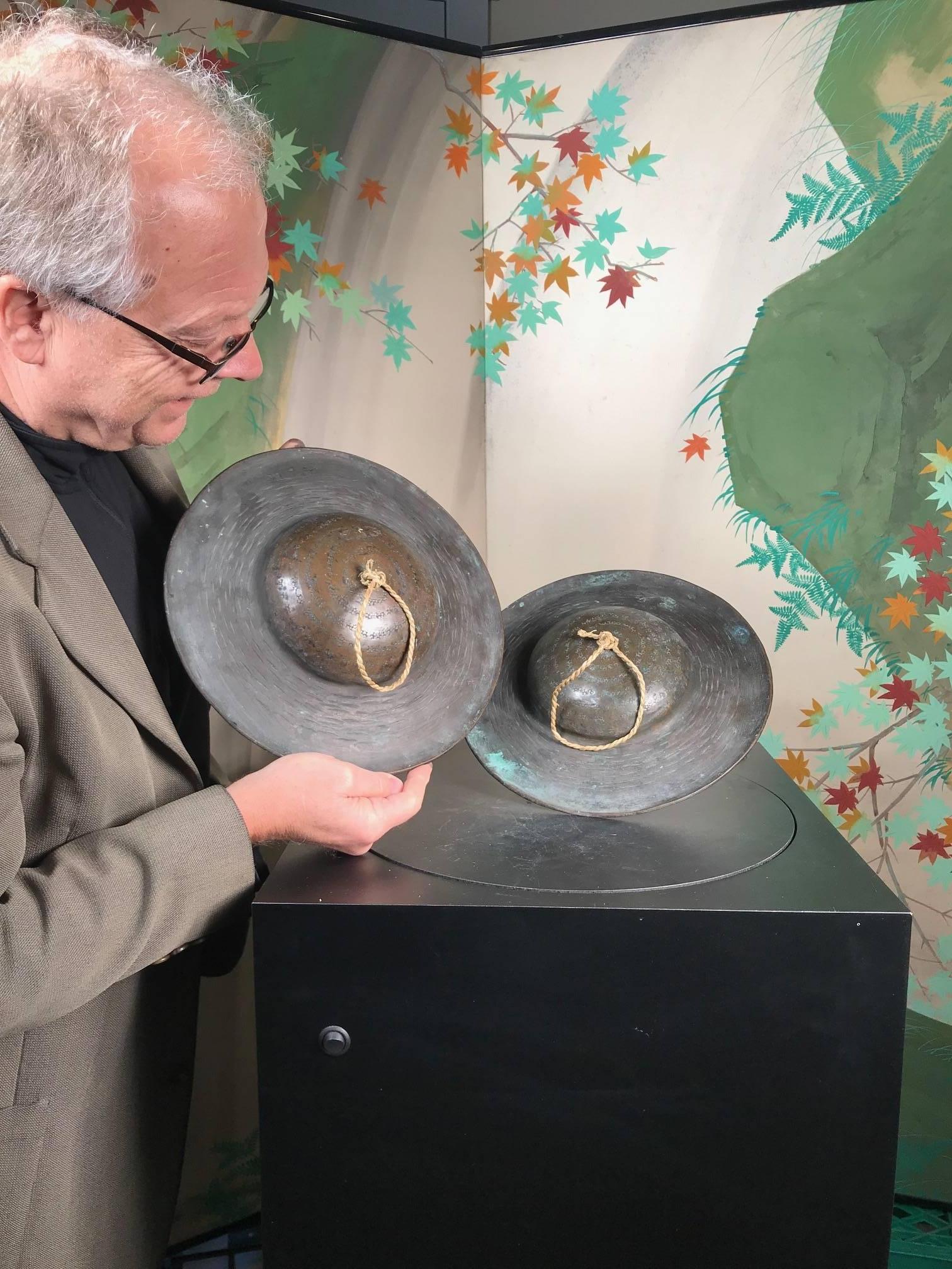 SALE - NOW SAVE 20% OR MORE

A fine pair of Japanese antique 19th century cymbals hand cast in solid bronze with fine scrolling details- examples that have been played no doubt with great inspiration. 

Fine condition with replacement rope handles