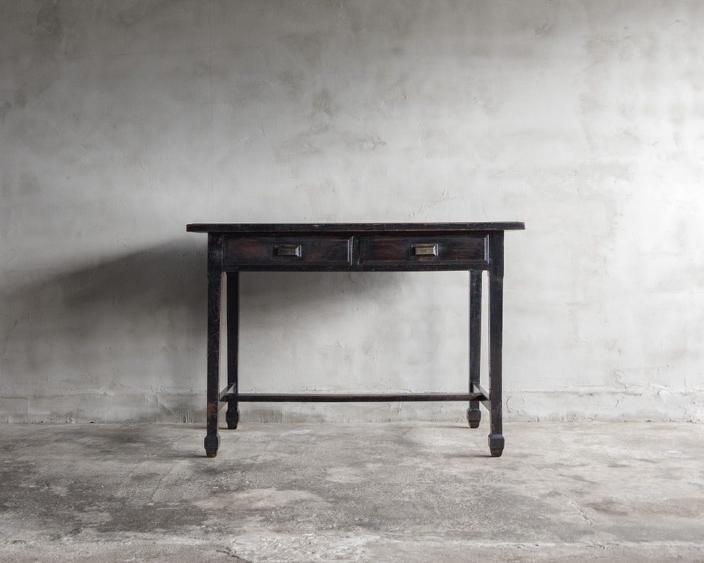Taisho era Antique Desk/Writing Tables- Oak and Chestnut, Repainted Black

This desk, an antique from Japan's Taisho period (1912-1926 CE), serves as both a desk and a table. is a rarity in Japanese design.
It features Japanese oak legs and a