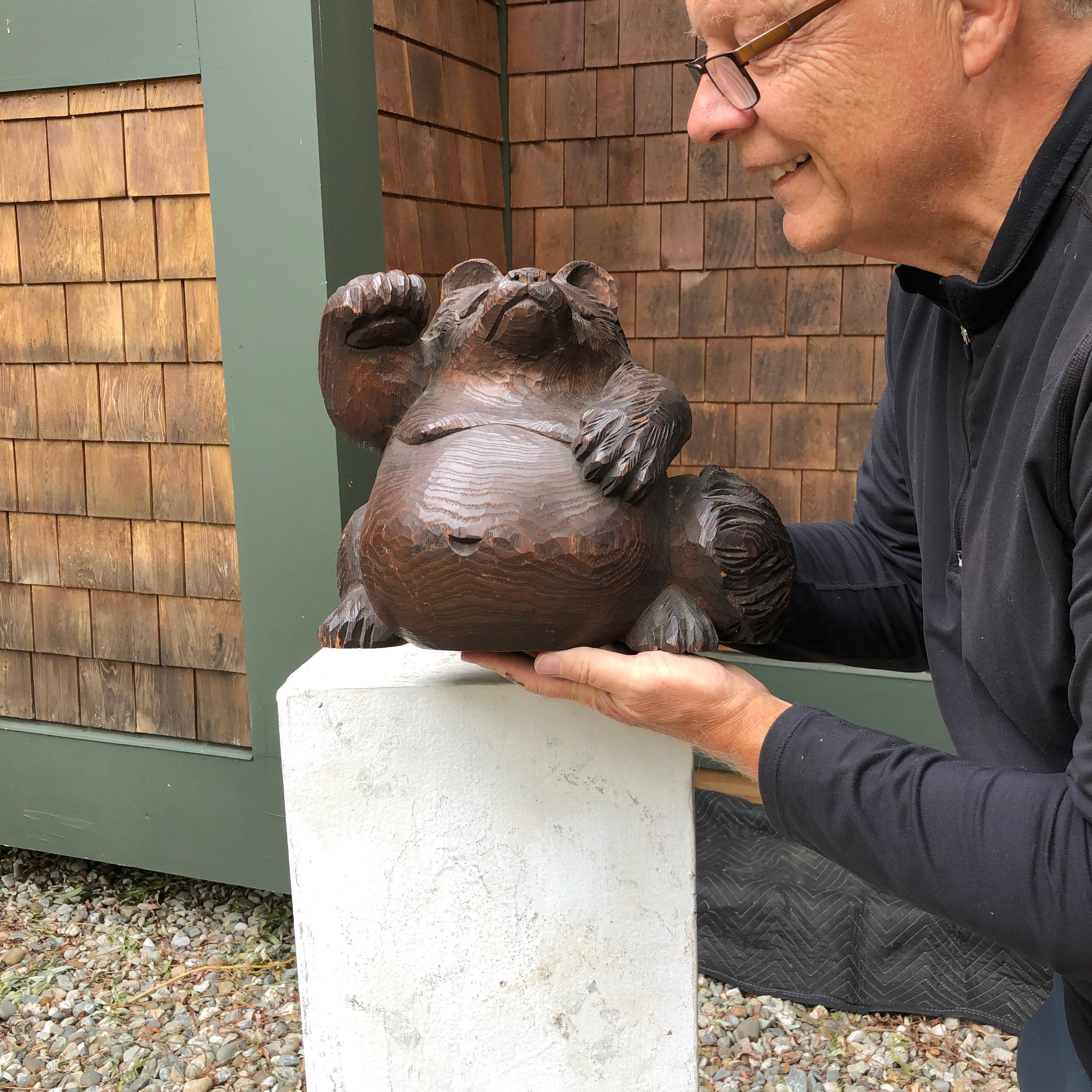 From our most recent acquisitions trip to Kyoto and Southern Japan

An antique hand carved solid wood tanuki carved by a master artisan and Japanese sculptors of wood. Carved from a single log, this little gem exudes charm and specialness, after