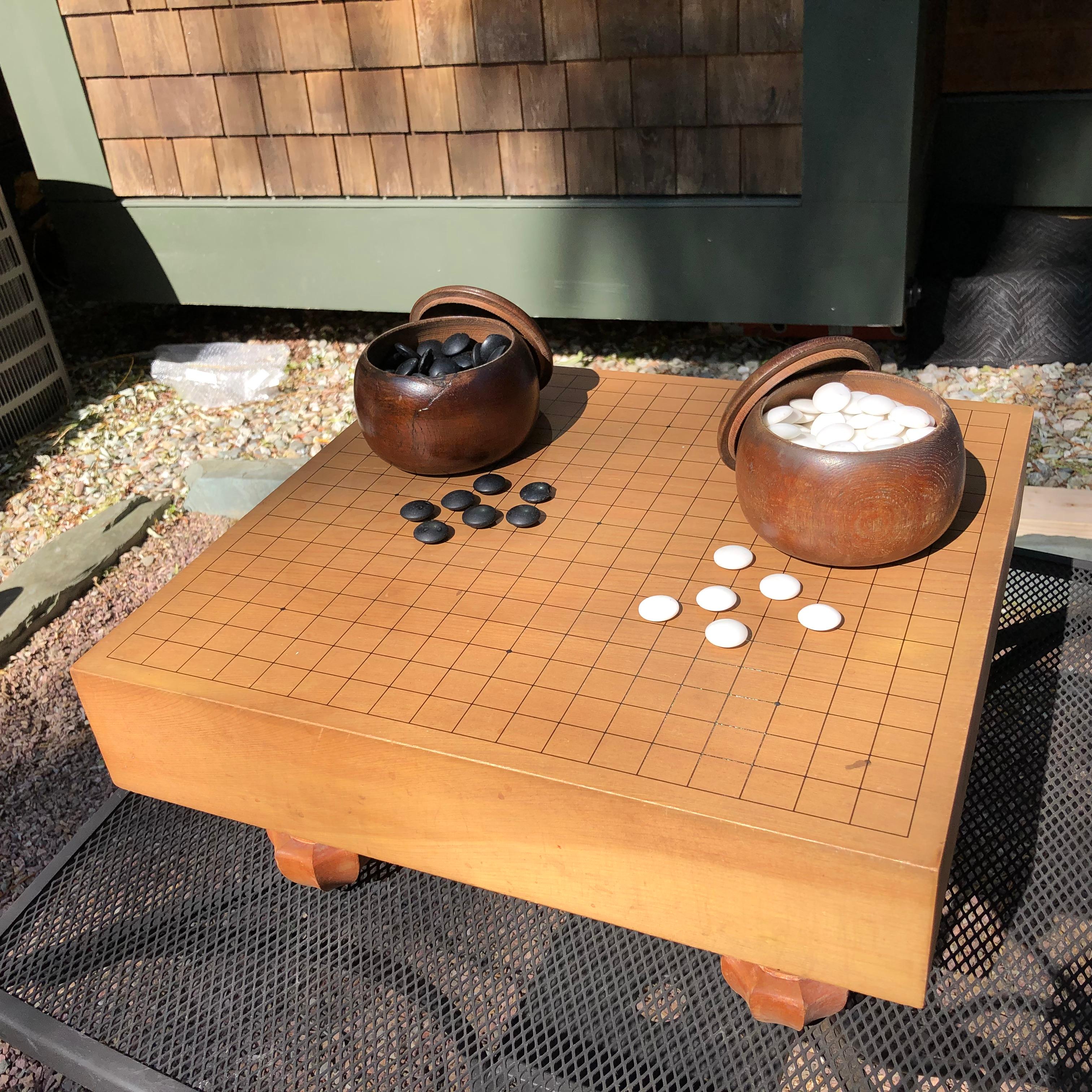 From our recent Japanese travels

This is a scarce and fun complete Japanese antique wooden goban “GO” board, circa 1915, handcrafted of Kaya wood.  It comes complete with the  original wood 
