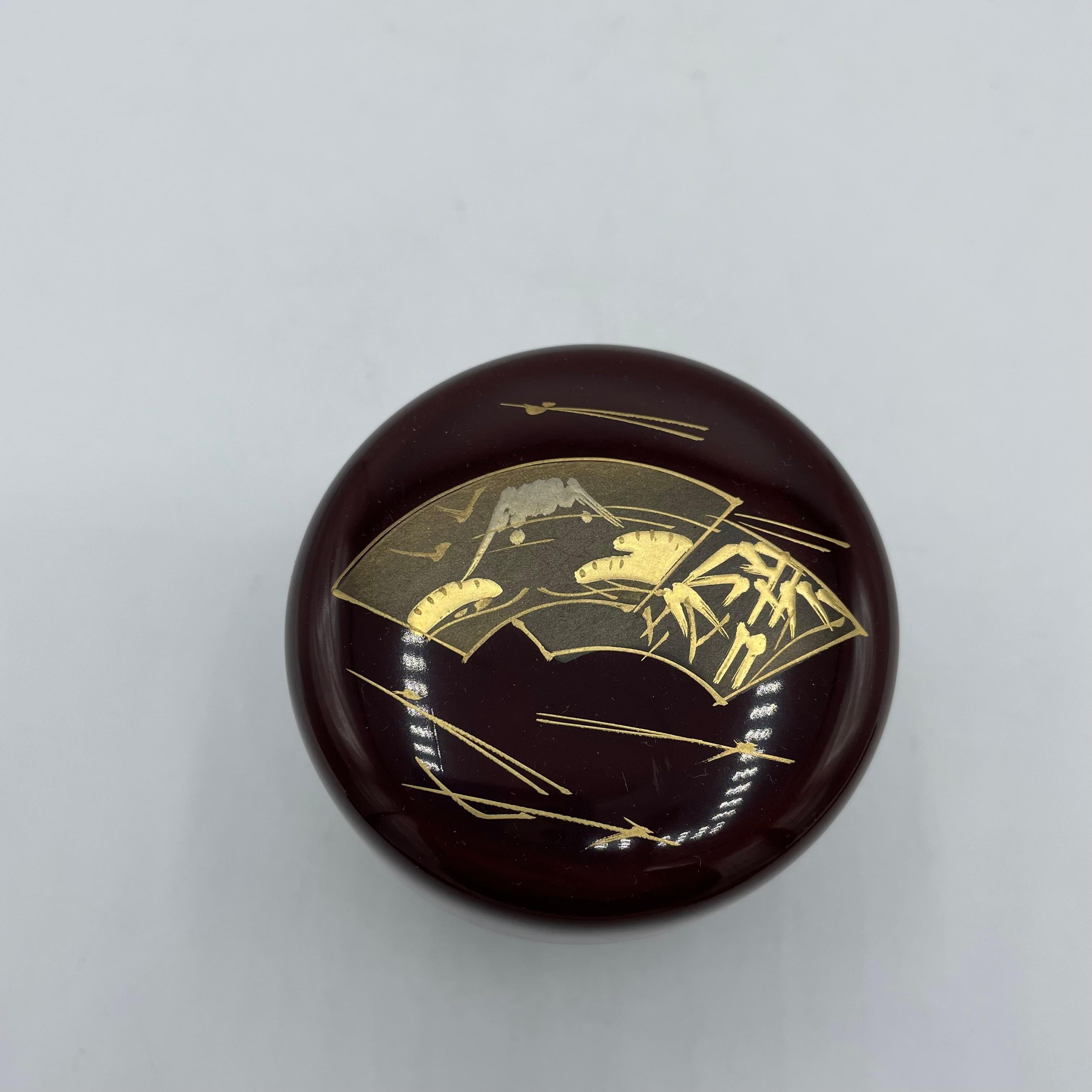 This is a box for the matcha powder using while tea ceremony in Japan.
It is called 'Natsume'. It is made with wood. The design is a mount Fuji and fans and it is hand painted. The material is with wood and lacquer.
This natsume was made in Japan in
