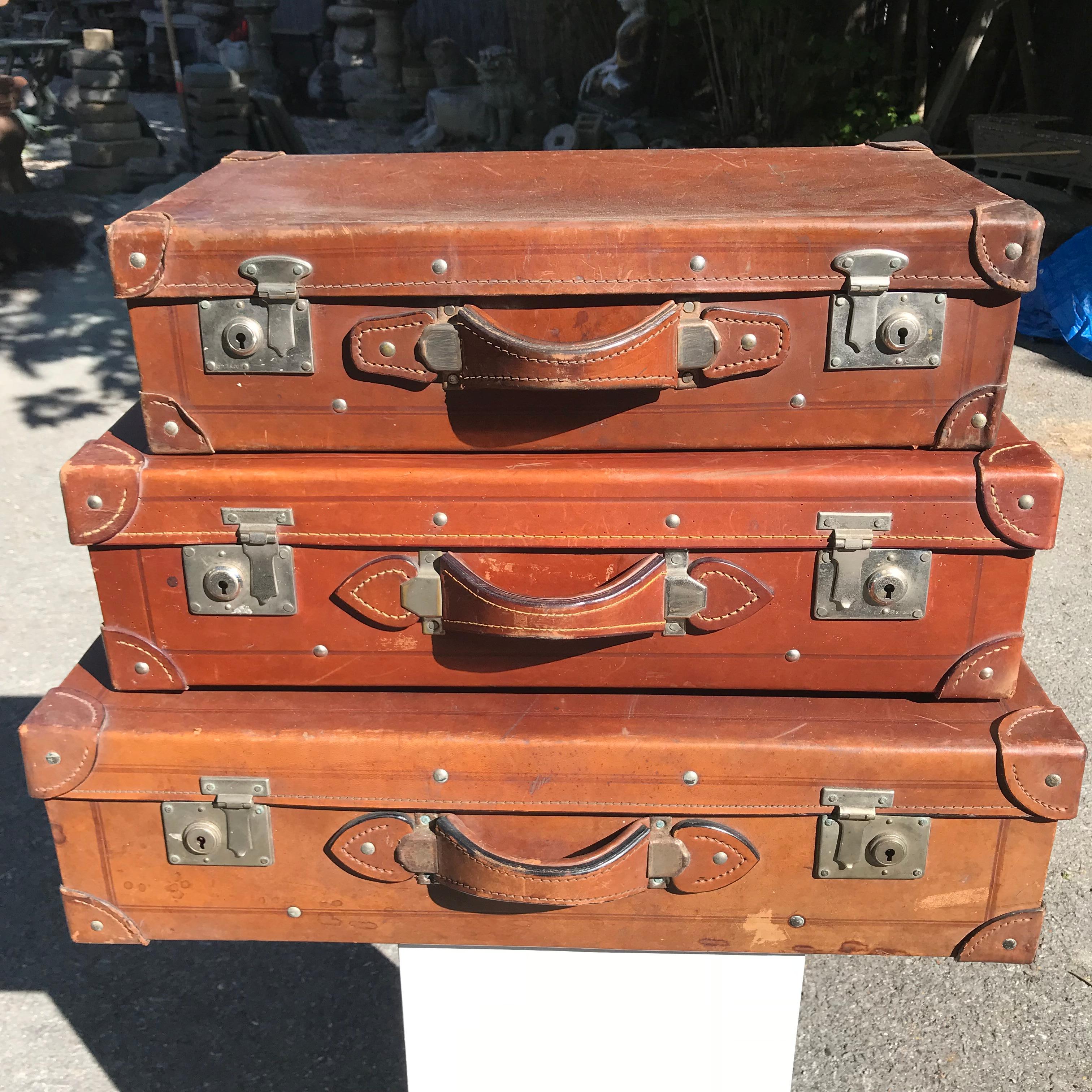 From our recent Japanese Acquisition travels & From a Private Japanese collection

Unusual set of Japanese antique leather Luggage Trio, signed and from the 1920s period.

This is a fine group of these elusive and collectible leather suit cases