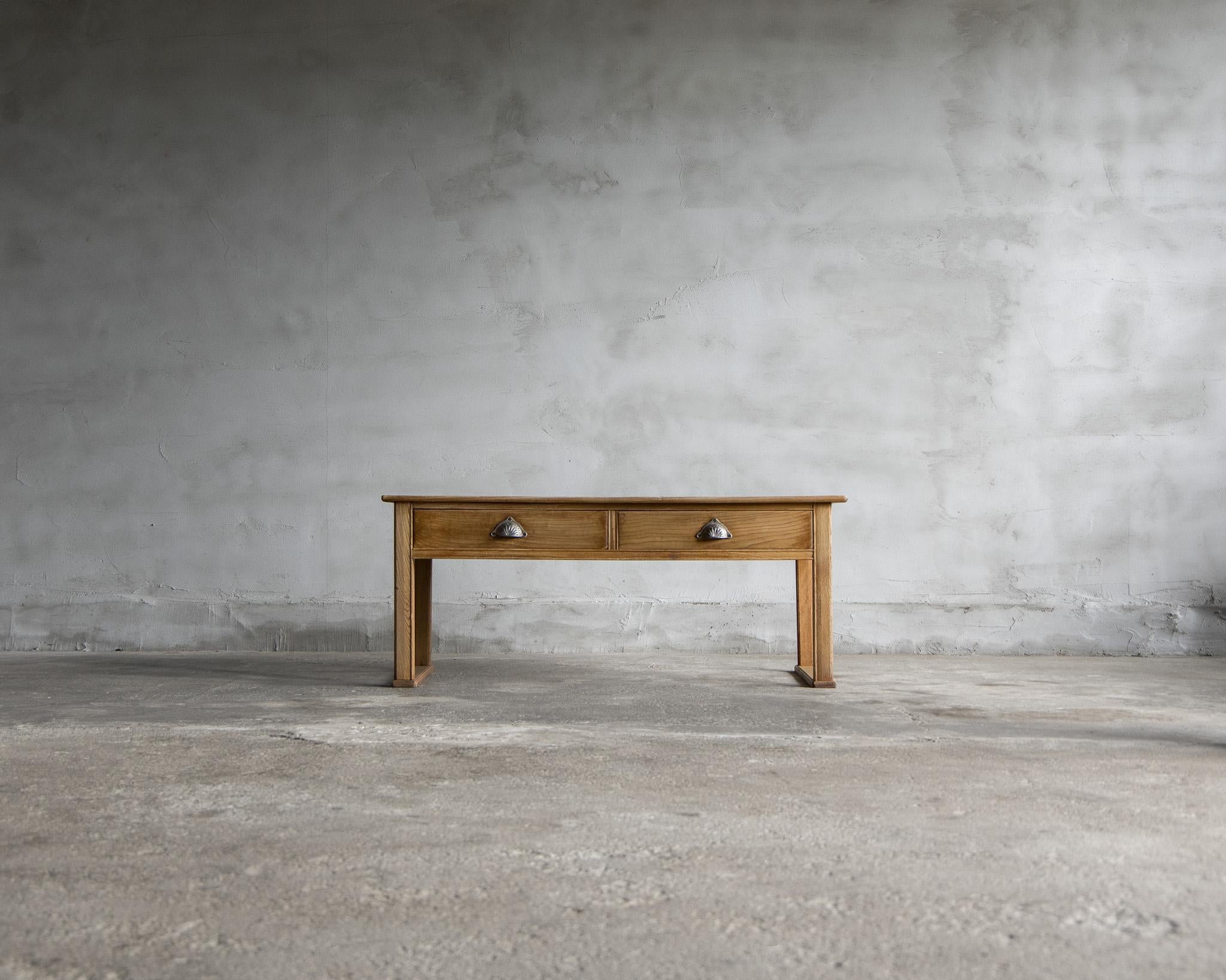 This is a low table of Japanese antique.
It was made in the Taisho period. (1912-1926)

It was used as a writing desk in Japan, a culture that lives sitting on the floor.
It is equipped with a horizontal wood called tatamizuri, which is attached to