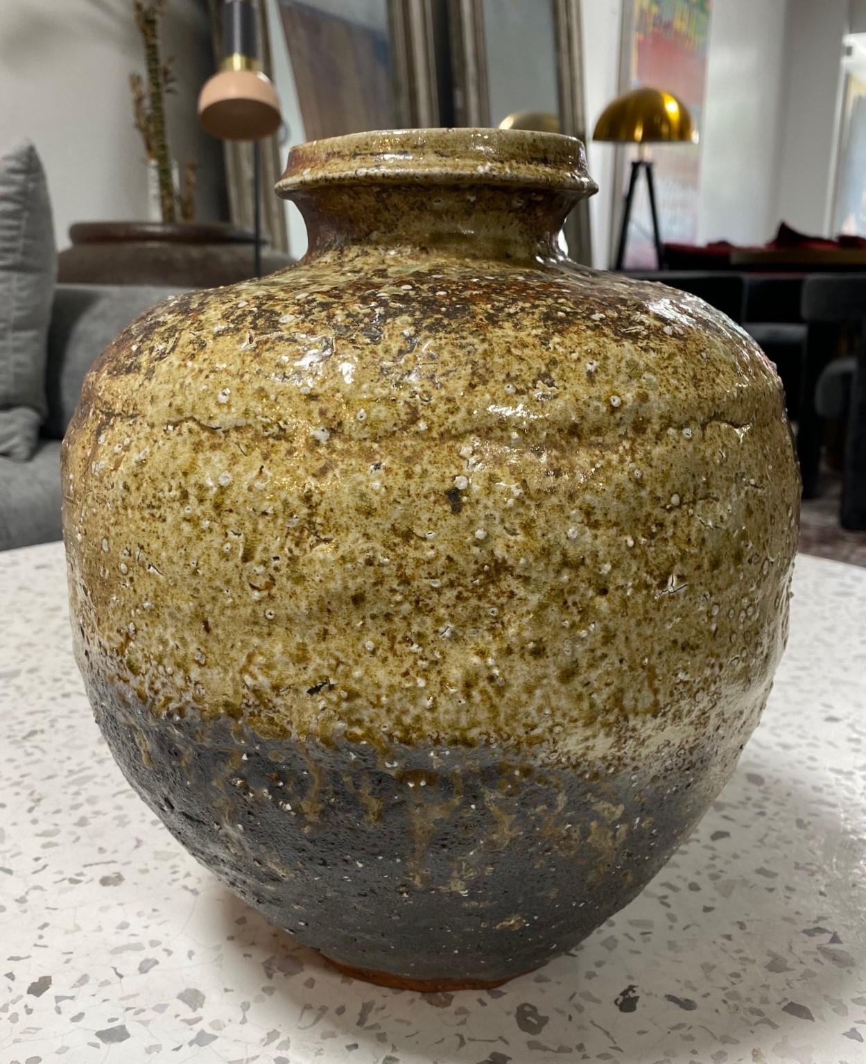 This gorgeously shaped organically glazed stoneware Shigaraki tsubo jar/vase is truly a stunning and unique work - one of our personal favorites. The natural, organic dripping ash glaze radiates in the light. This is a very unique glaze that