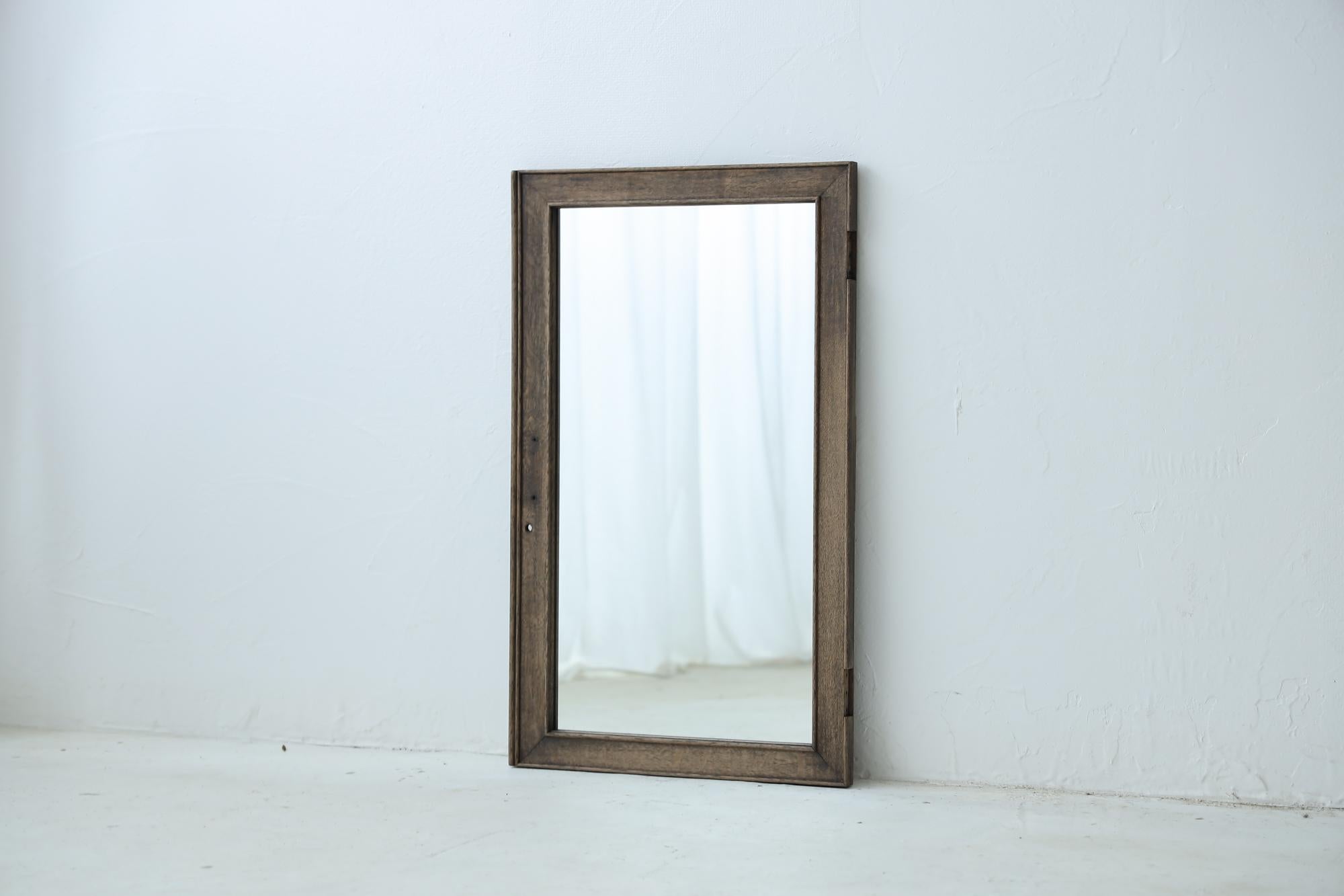 Introducing a unique mirror crafted by repurposing old Japanese fittings, this piece exemplifies the pinnacle of traditional craftsmanship. Made from architectural elements of the Taisho period, it merges historical significance with contemporary
