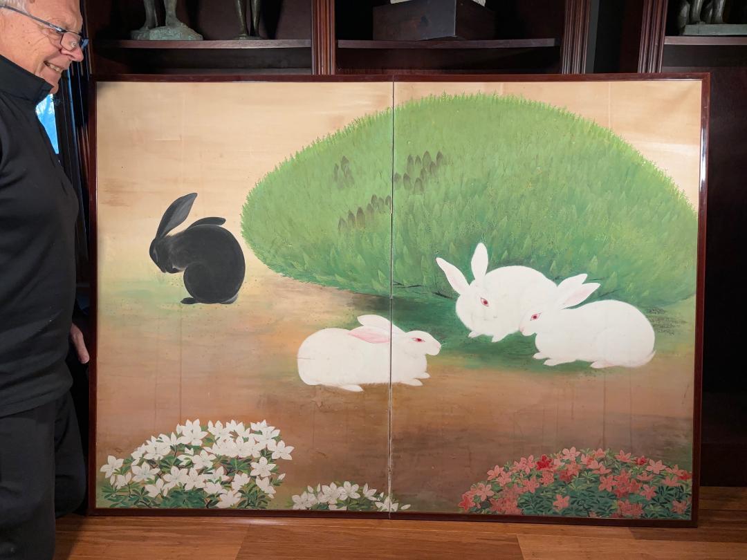 Japan, a small and unusual two panel tea screen of four playful rabbits amidst pink and white flowers in, byōbu.  It dates to the Taisho period. 

Dimensions: 41 inches high and 56 inches wide extended.

Enticing hard to find subject matter, this