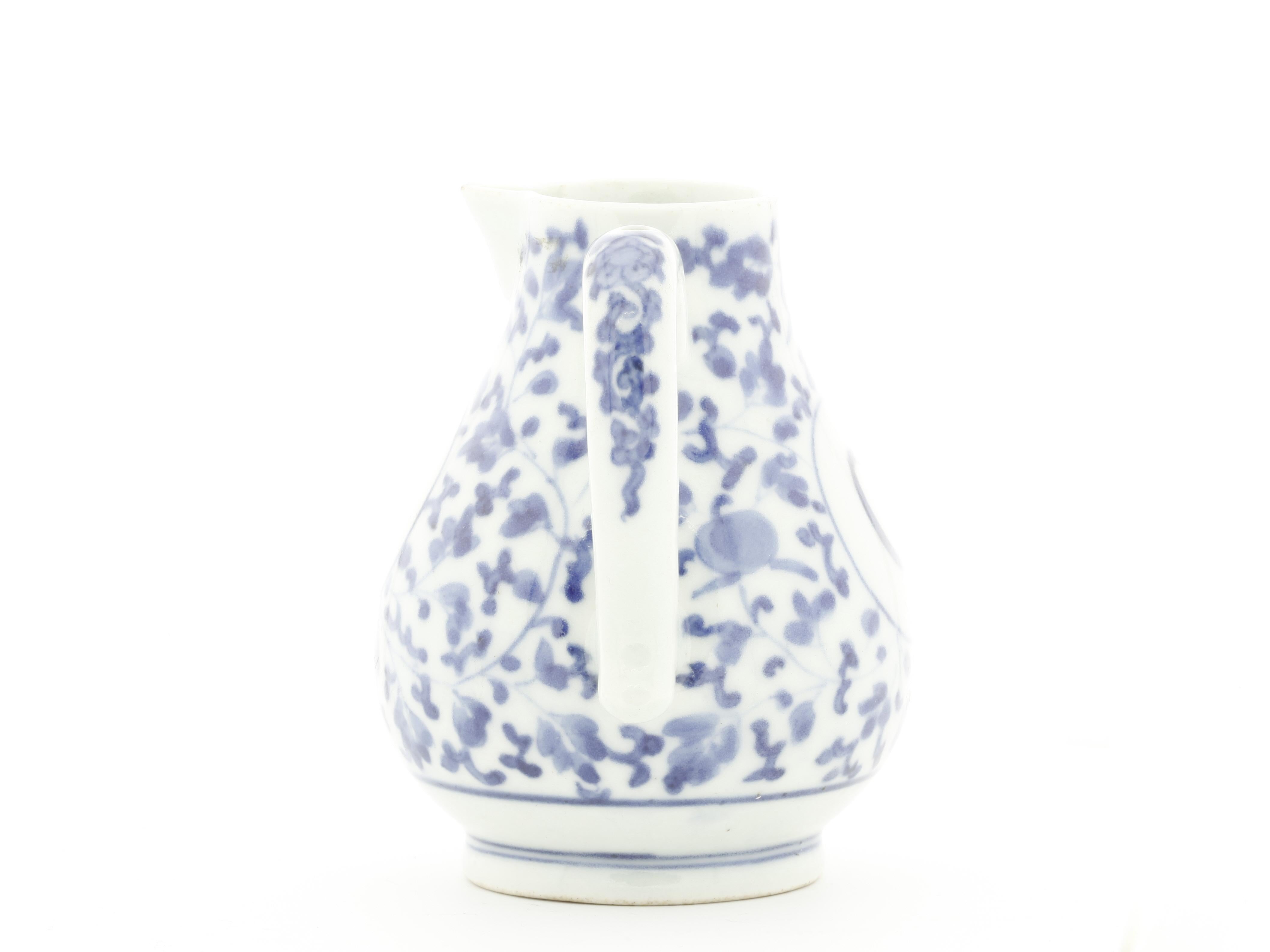 Title: Blue and White Imari Oil Ewer
Date: Early 18th century
Dimensions: 8.5 x 10.4 cm

An oviform imari oil ewer with underglaze painting in blue, a roundel bears the initial 'O' (oil). 

This blue and white imari ewer is representative of