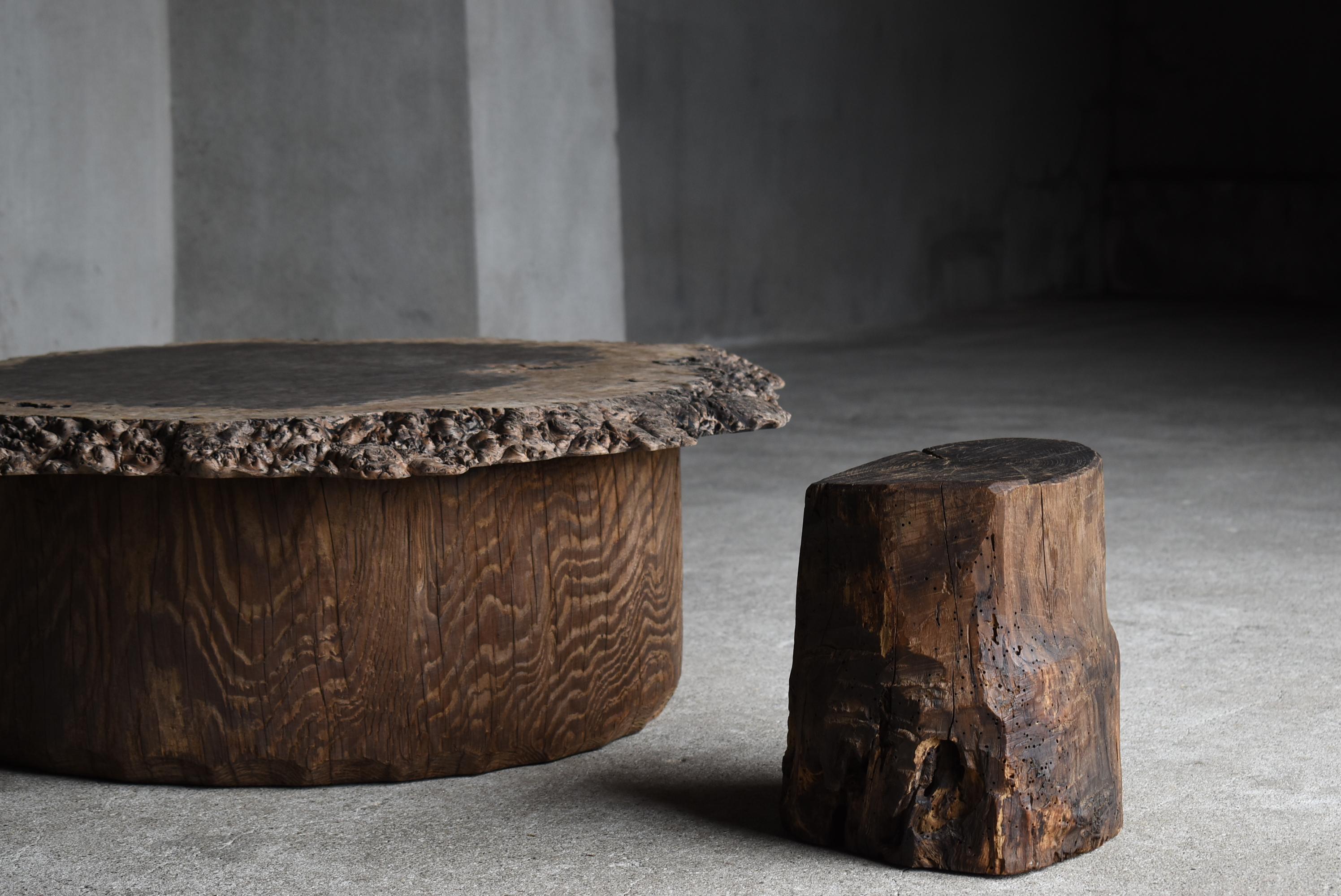 This is a very old primitive style stool made in Japan.
It was made during the Meiji period (1860s-1900s).
It is carved from chestnut wood.

It was used as a working chair by farmers.
It is rustic, simple and beautiful.

There are some insect bite