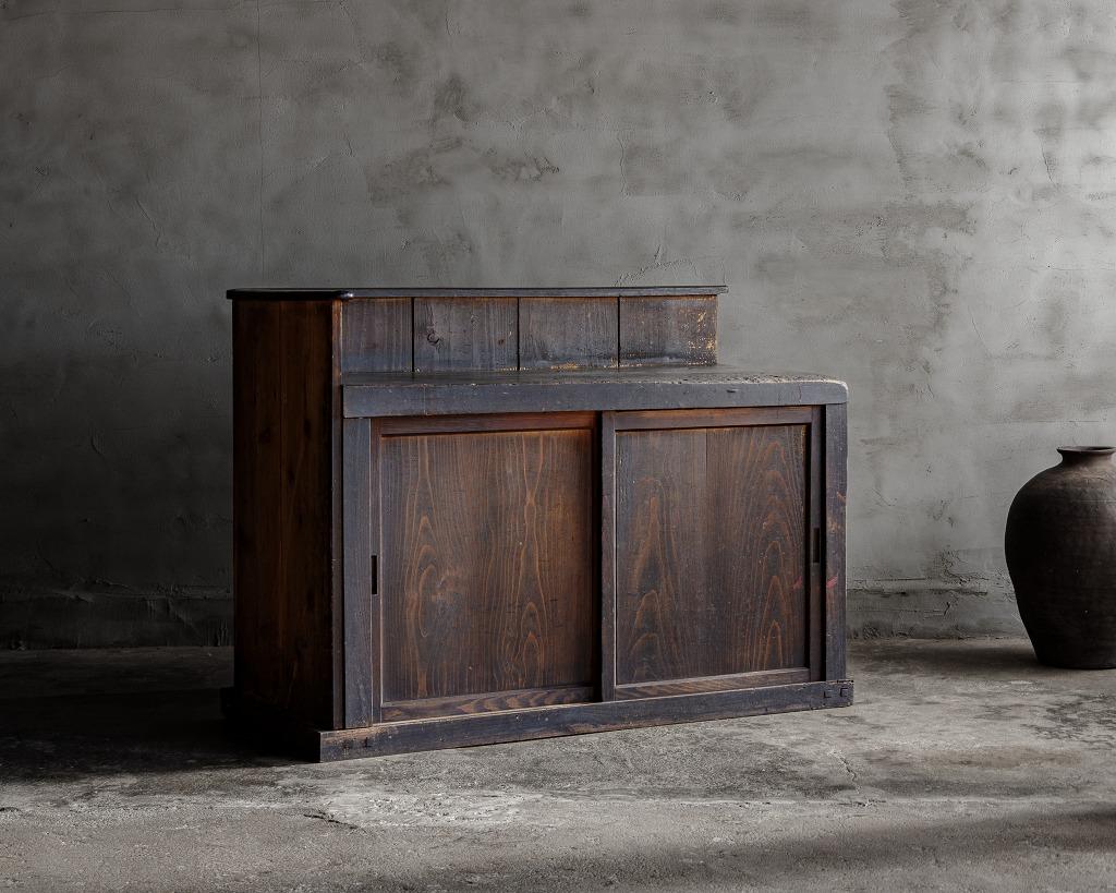 This is Japanese Antique Sliding Door Cabinet.

This antique sliding door cabinet, crafted in the Meiji period (1868-1912), embodies the timeless aesthetic of 'wabi-sabi', the Japanese art of finding beauty in imperfection. Its unique charm is