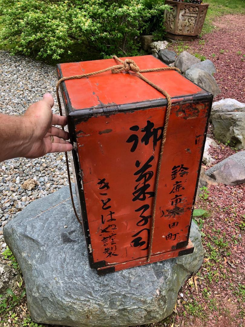 Japanese decorative antique 19th century hand carved and hand painted red lacquer heavy wood jubako, would make a superb eye catching end table. Inside boasts four serving and unique entertainment trays!  It possesses excellent detail and original