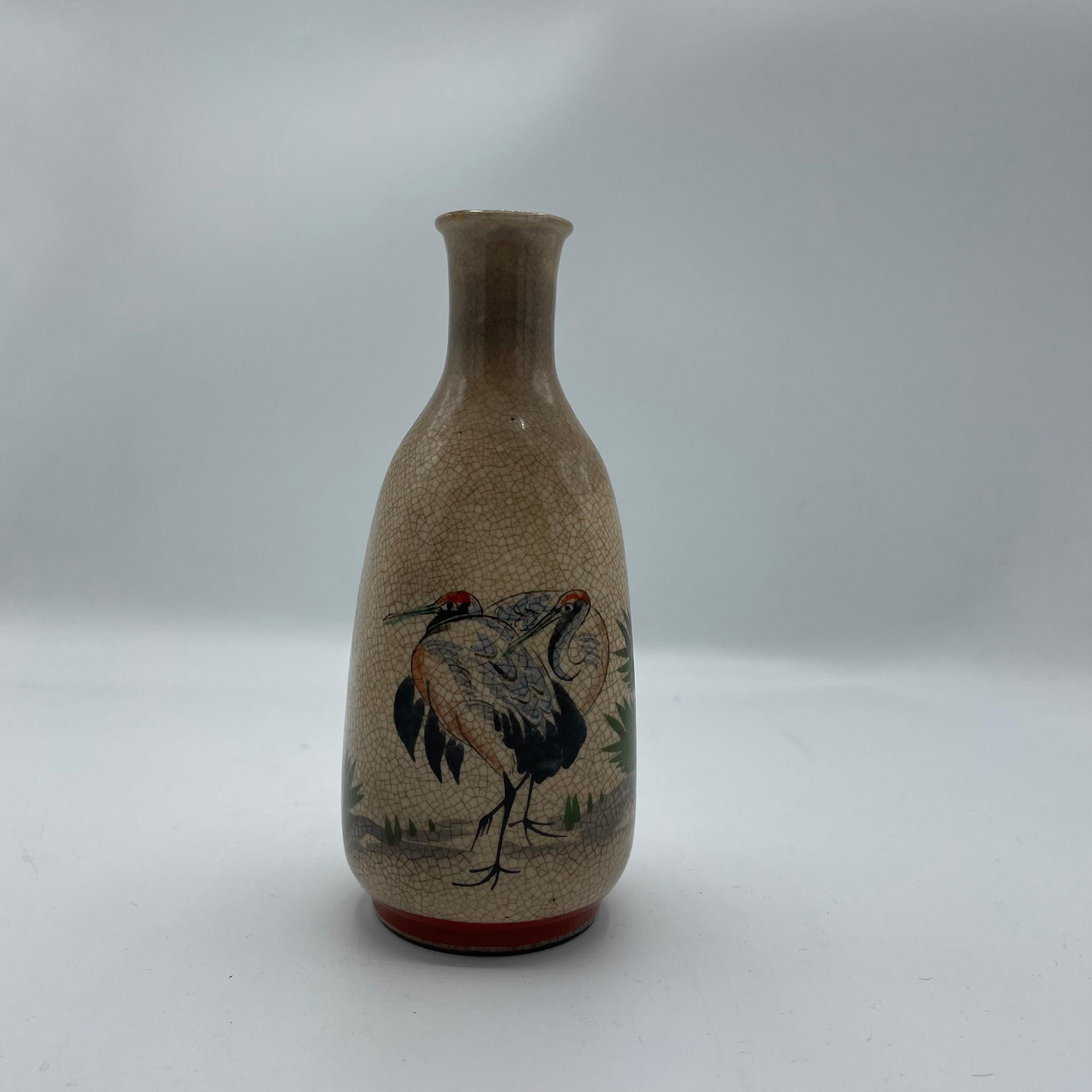 This is a bottle for sake. It can be used as a bottle and also as a flower vase.
This was made in Japan around 1960s in Showa era and it is made with Porcelain.

Dimensions: 6,5 x 6,5 x H14,5 cm 