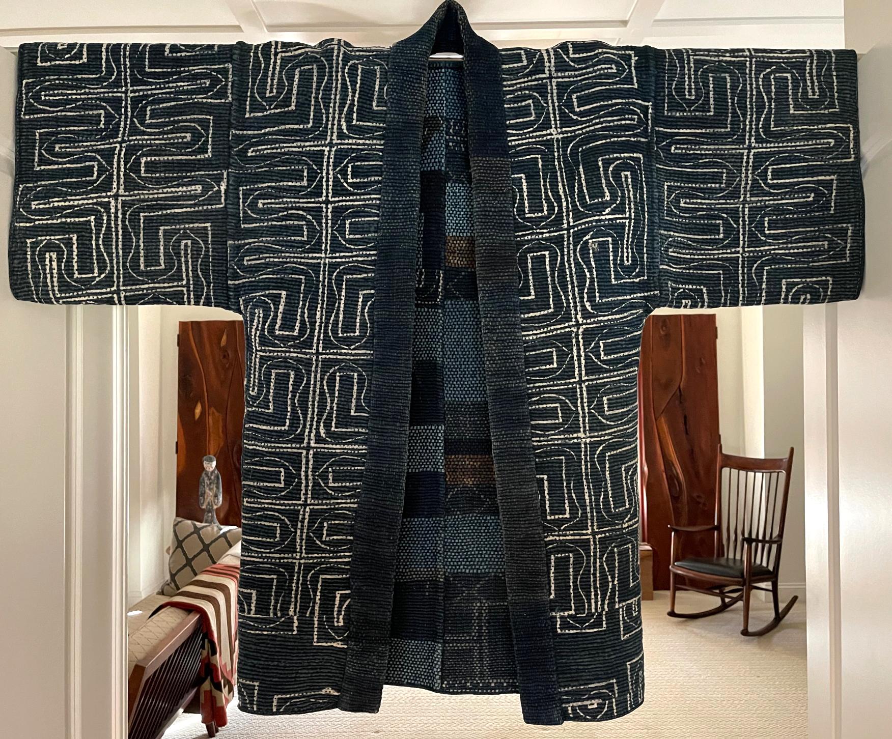 A charming Japanese farmer's jacket with Mingei folk art style. The woven construction is known as Saki-ori, an innovative and expressive technique that recycles and reuses fabrics. The discarded textiles were shredded into thin strips and used as