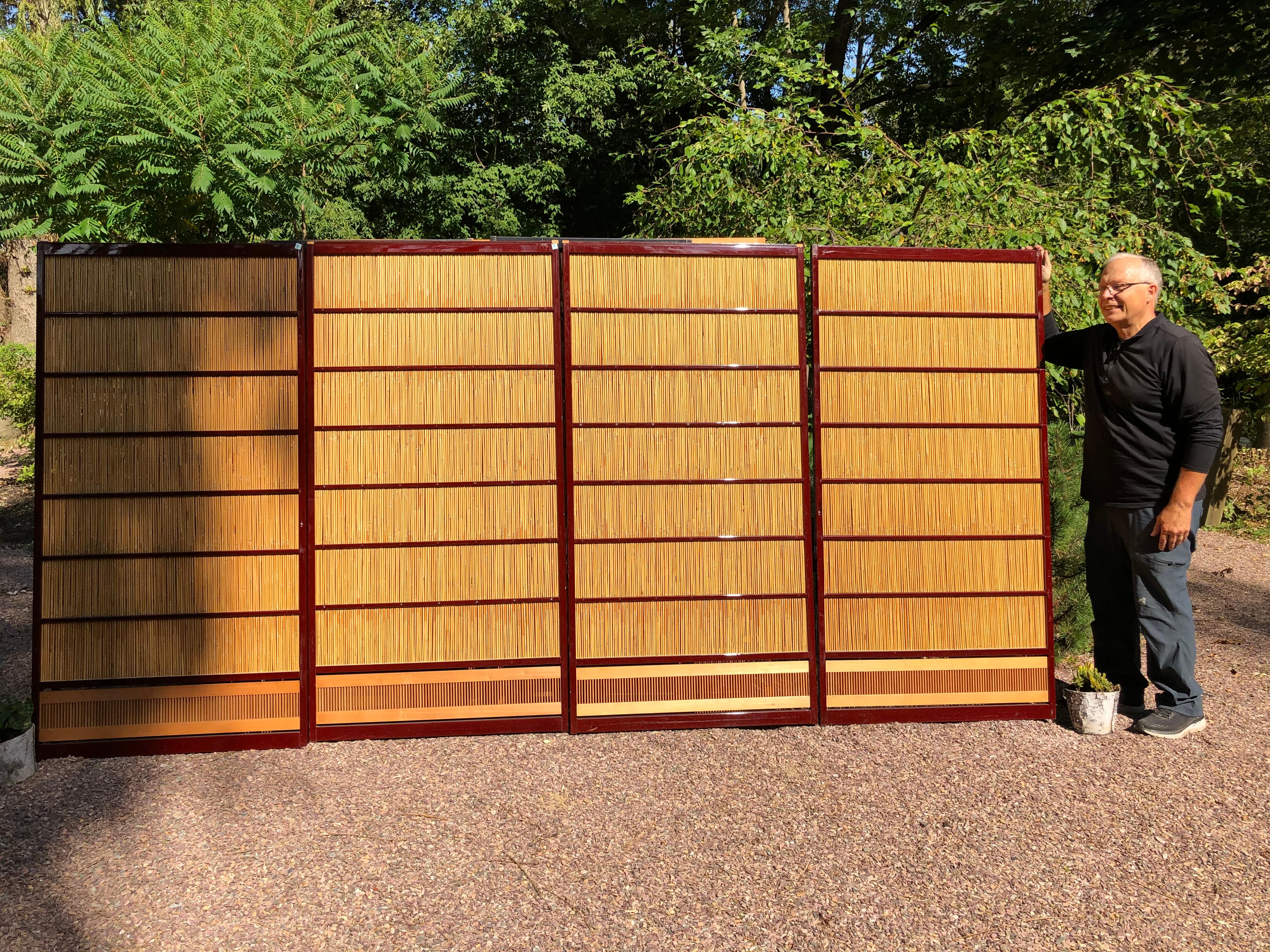 Japan, a fine set of four shoji red lacquer bamboo doors or screens recently acquired from a Japanese private collector. The hand carved bottom boards are artistically cut with vertical pattern and inserted as decorative borders.

Lovely examples
