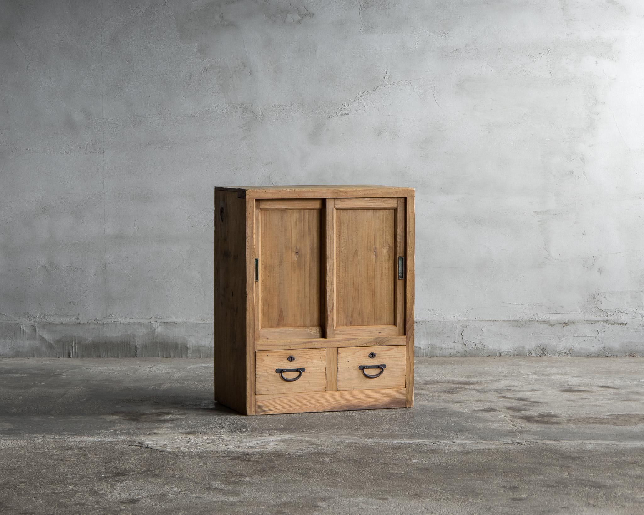 This is a small cupboard of Japanese antique.
It was made in the Taisho period. (1912-1926)

This is a charming little cupboard that exudes a rustic allure. Crafted from natural cedar wood, its warm texture brings coziness to any interior.

Despite