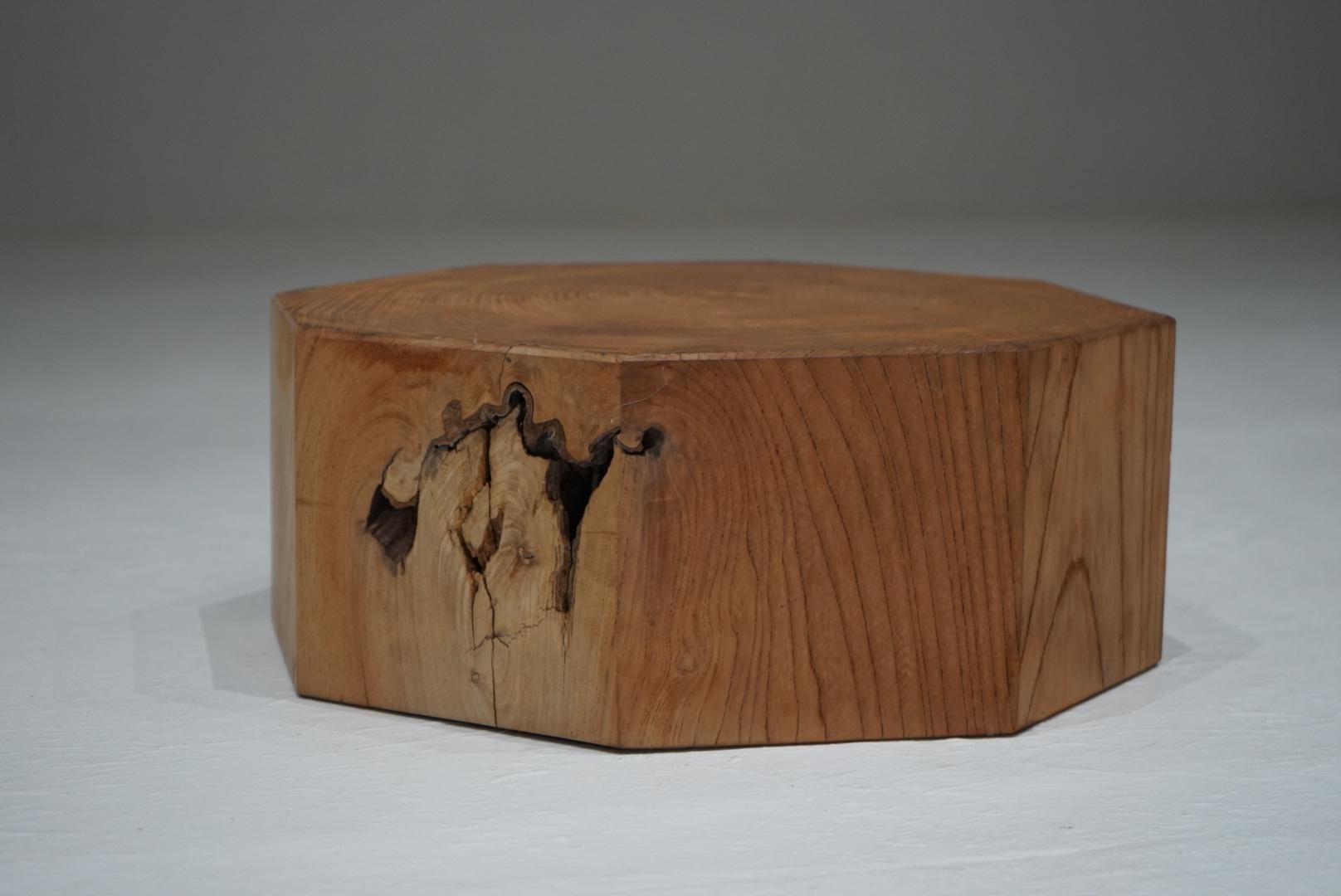 A Japanese antique octagonal display stand carved from solid zelkova wood.
The exact date is unknown, yet the piece carries a distinctly primitive presence, shaped with a quiet strength that feels deeply rooted in material and form.
Its eight-sided