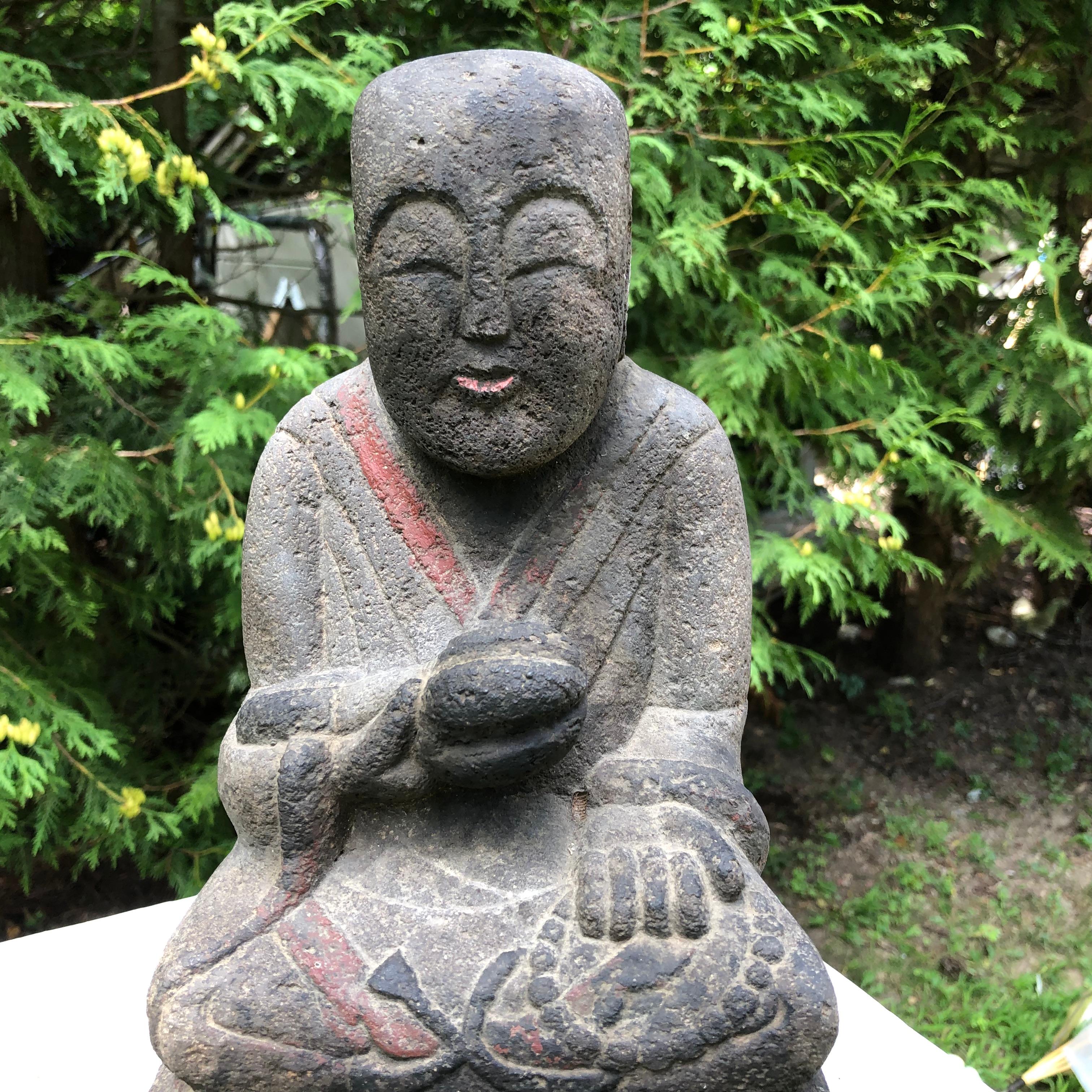 For your special garden

Japan, a fine serene faced hand carved and hand painted stone seated Buddha Holy Man dating to the Taisho period, early 20th century. The effigy of the Buddha with realistic and joyful face hand carved in solid stone and