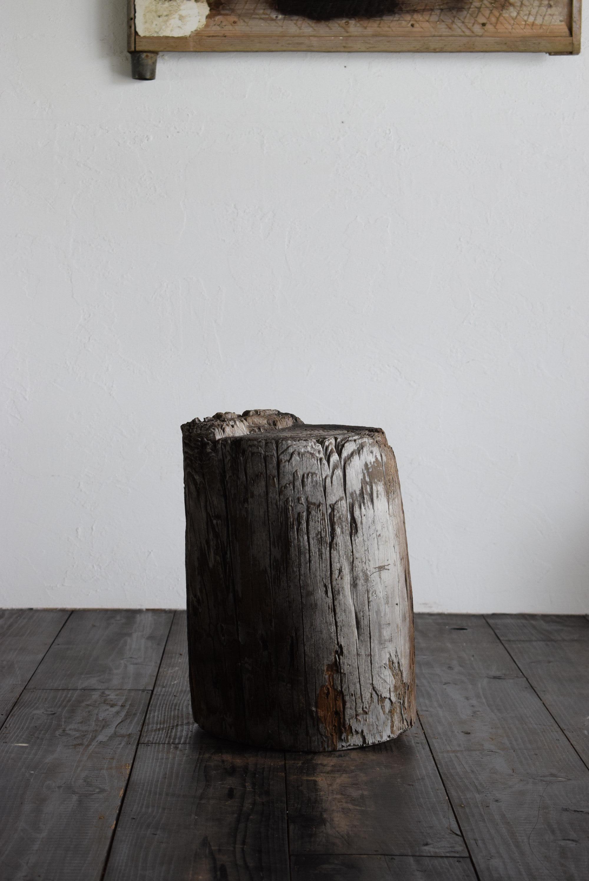 This stool is made from a stump that was cut down from a pine tree. The polished parts give the impression that the chair has been touched and enjoyed. 

In addition, to adjust the instability, another wooden board is attached to the bottom, giving