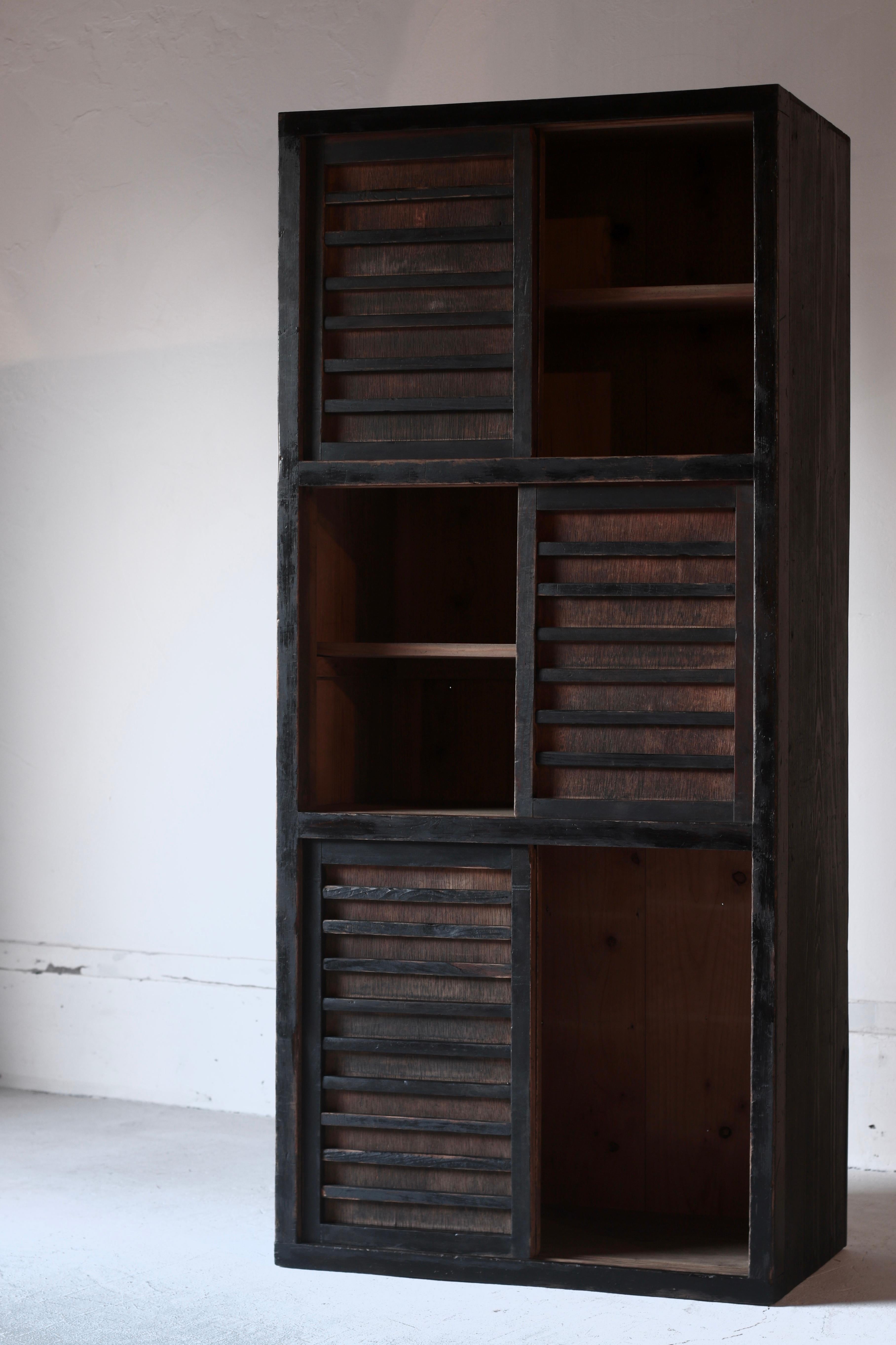It is a cedar cabinet that was used in an old private house in Japan.

It is dyed black using 