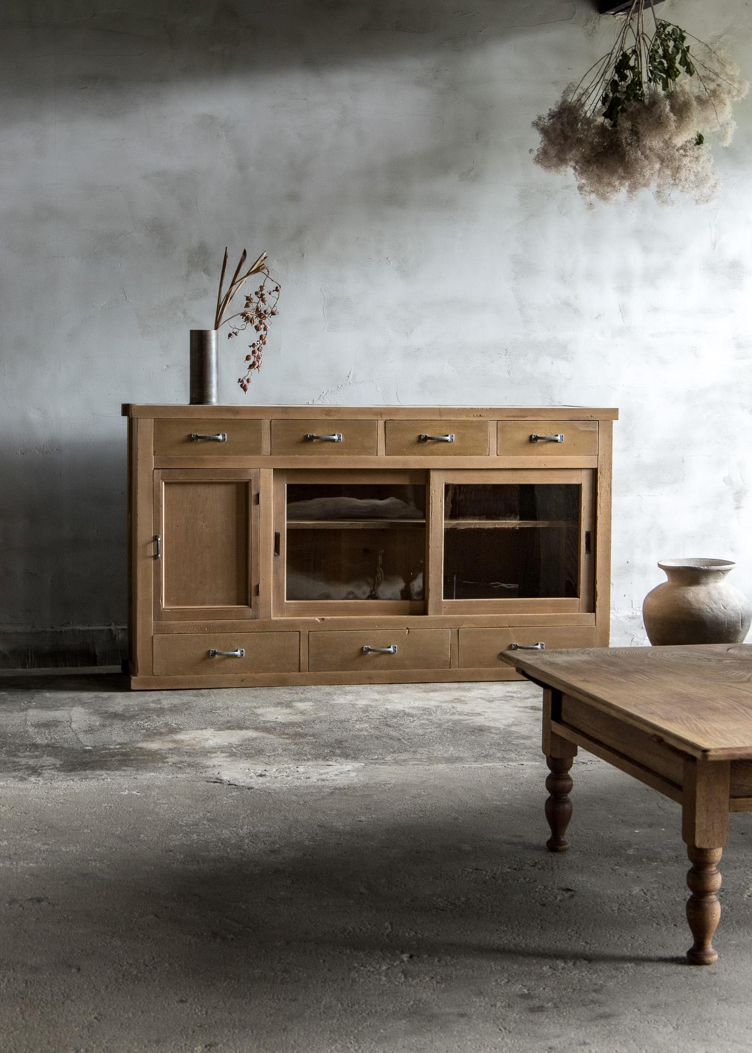 This antique cabinet was crafted in the Early Showa Period (1926–).

It was originally used as a traditional Japanese kitchen cabinet, or Mizuya Tansu, designed to store tableware and cooking utensils efficiently and beautifully.

Made from Japanese