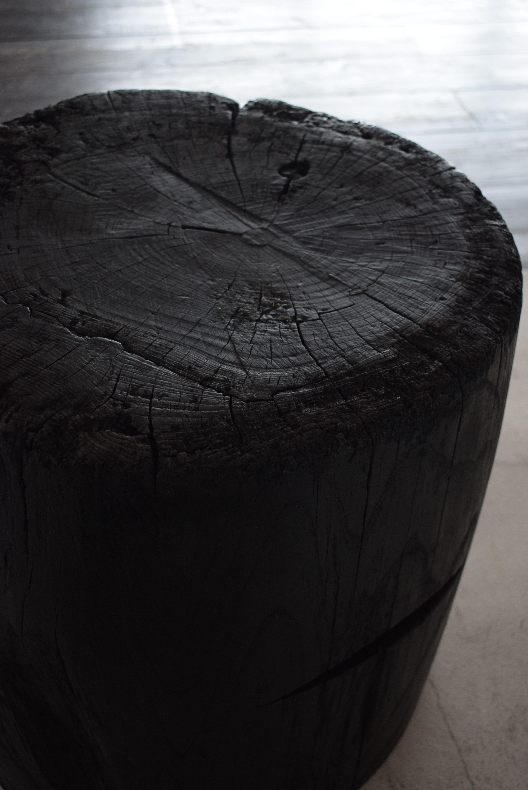 A table made from an old Japanese mortar (a container used for pounding grain and rice cake with a pestle. Things are placed inside the mortar).

It is a heavy and sturdy table that has a Japanese feel and gives you a sense of wabi-sabi.