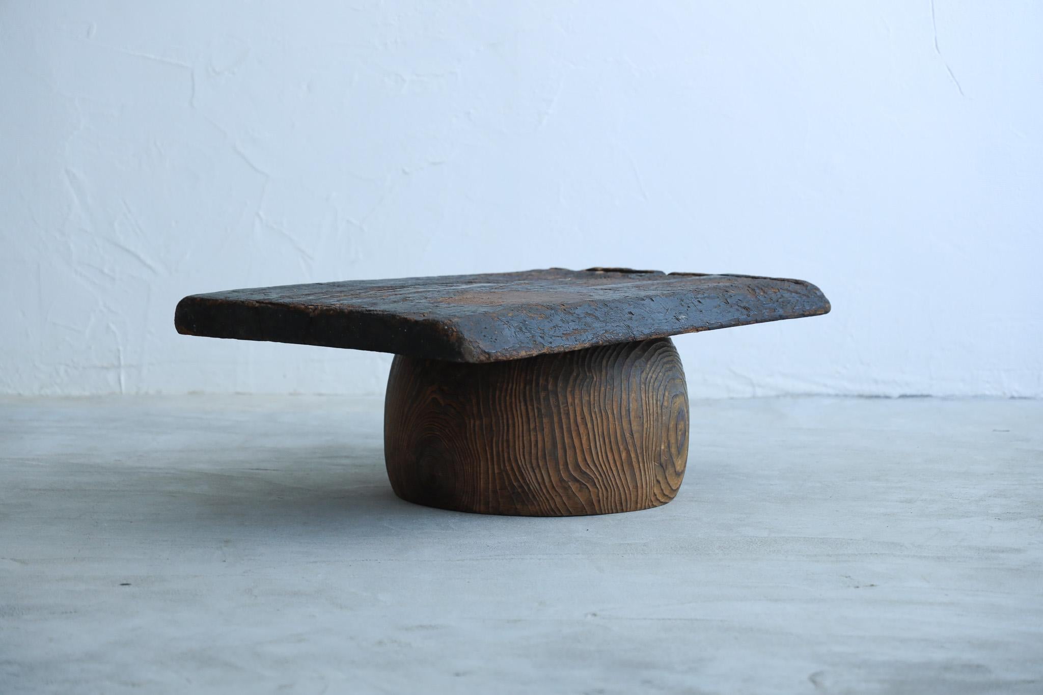 This low table is a harmonious combination of a single piece of wood from the Meiji to Taisho eras (1986-1926) and a traditional brazier.

The table top is made of chestnut wood and has a characteristic smoked color. The brazier is made of cedar