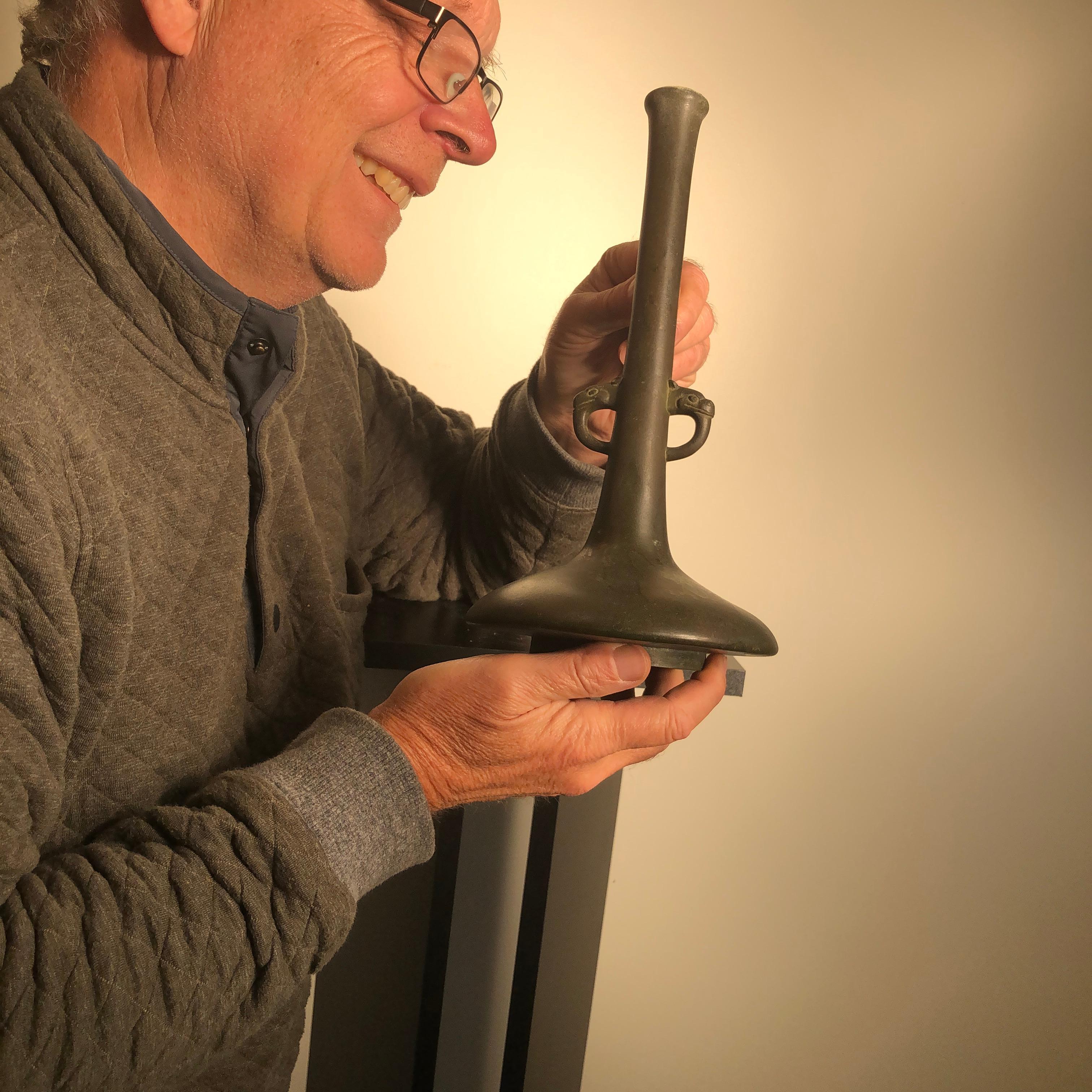 A fine old Japanese hand cast bronze Tulip Bud vase with double elephant handles. Fine condition. Finely cast in a simple form with elephant form handles banded mid section. A great table setter or wonderful decorative accent for dried or fresh