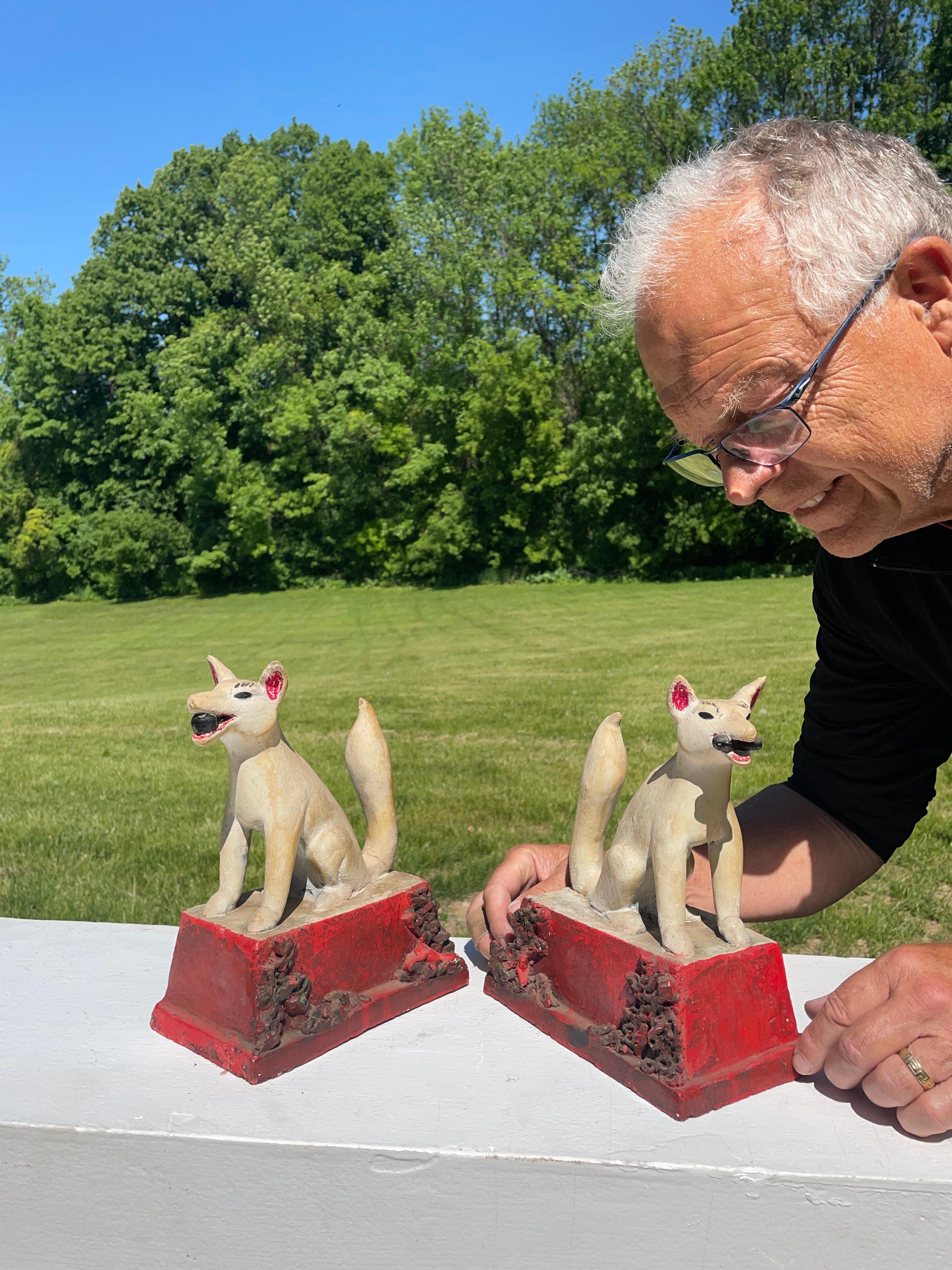 Japan, a fine pair (2) of antique tall white, red, and black hand painted ceramic shrine fox kitsune, Taisho period, circa 1920. 

Hard to find early pair.

These are of a rare style seldom encountered. Please note the unusual red bases depicting