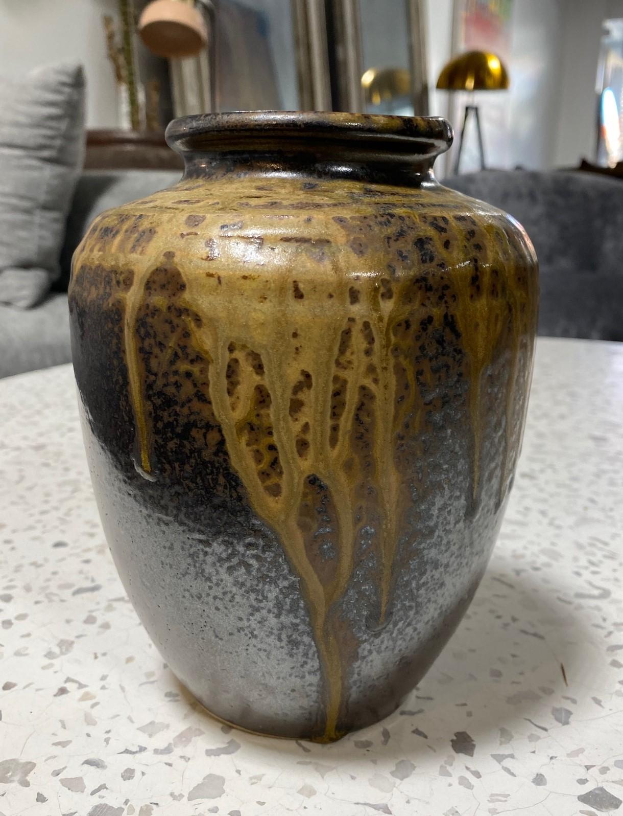 A wonderfully shaped gorgeously glazed Tamba (sometimes spelled Tanba) Ware pottery vase/ jar featuring a natural, organic ash glaze that absolutely radiates in the light. This unique glaze pattern happens by chance in the kiln. Aesthetically