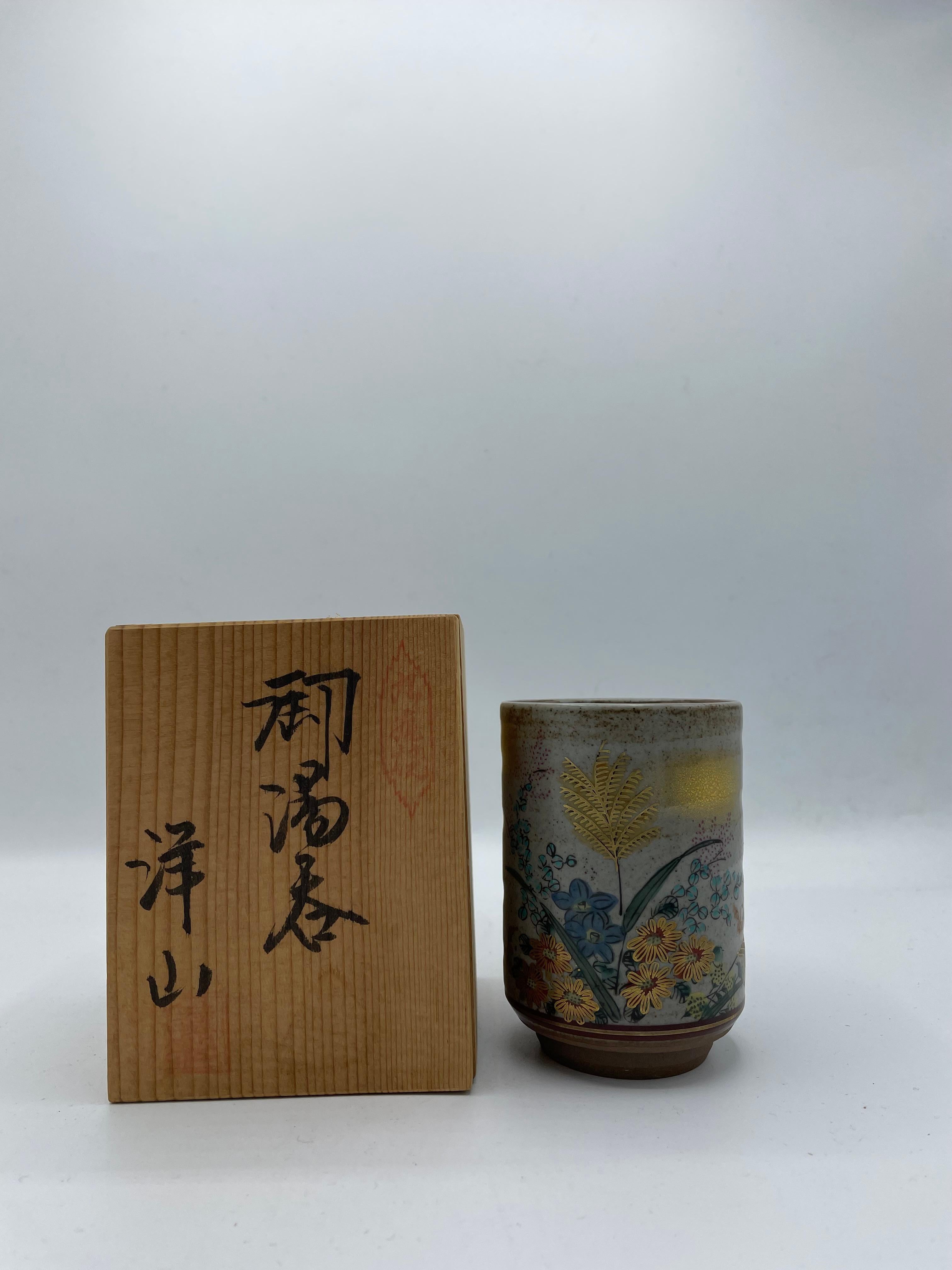 This is a tea cup which was made in Japan around 1950s in Showa era.
It was made with Kutani ware technique. And made by an artist called 'Yozan'.
It will come with a wooden box.

Kutani ware is a style of Japanese porcelain traditionally