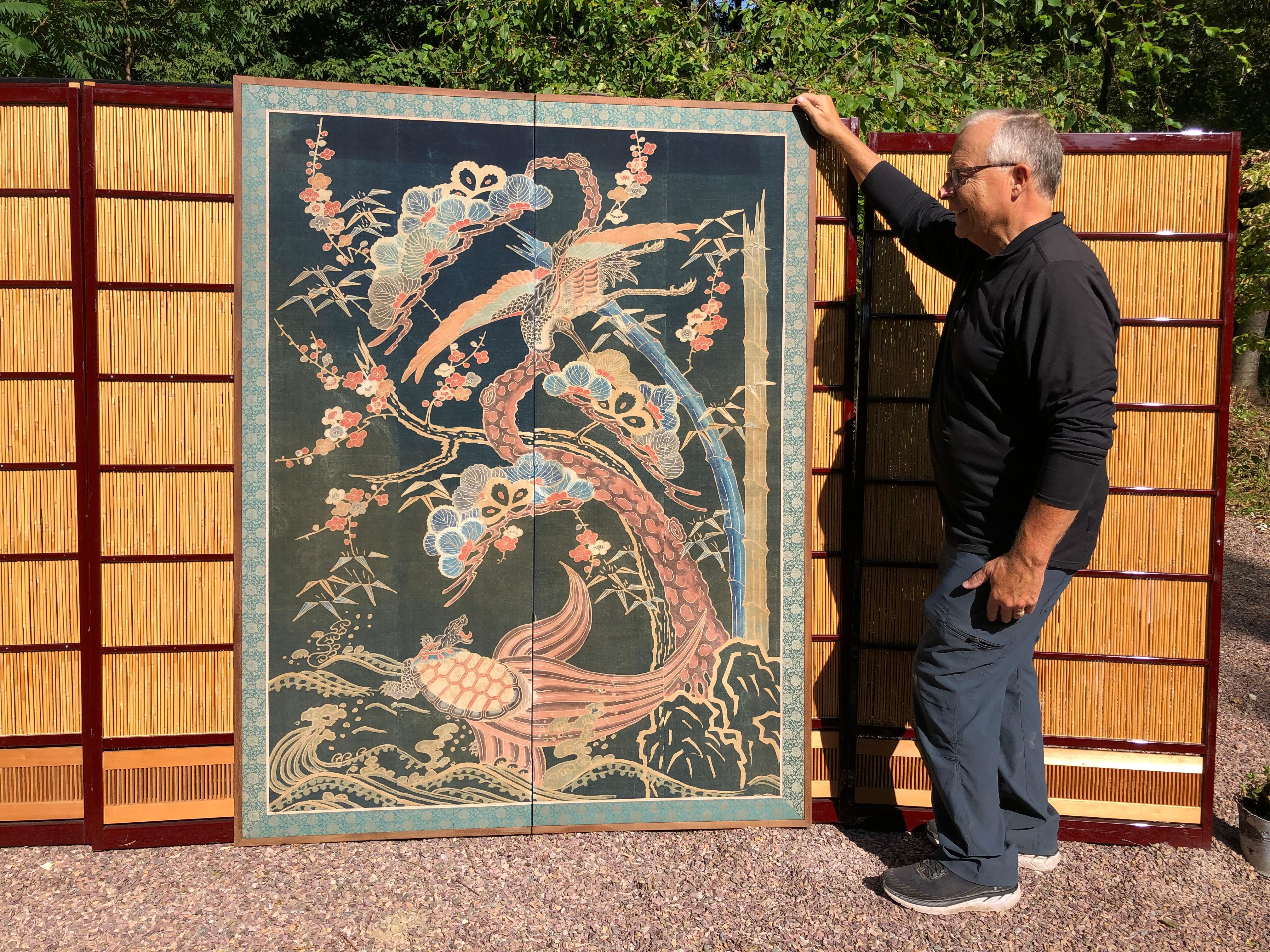 From our recent Japanese acquisitions travels- great wall art

A beautiful two panel screen created from a well-preserved futon cover tsutsugaki made of heavy cotton with the auspicious images of a large phoenix, turtle, sakura, scholar rocks, and