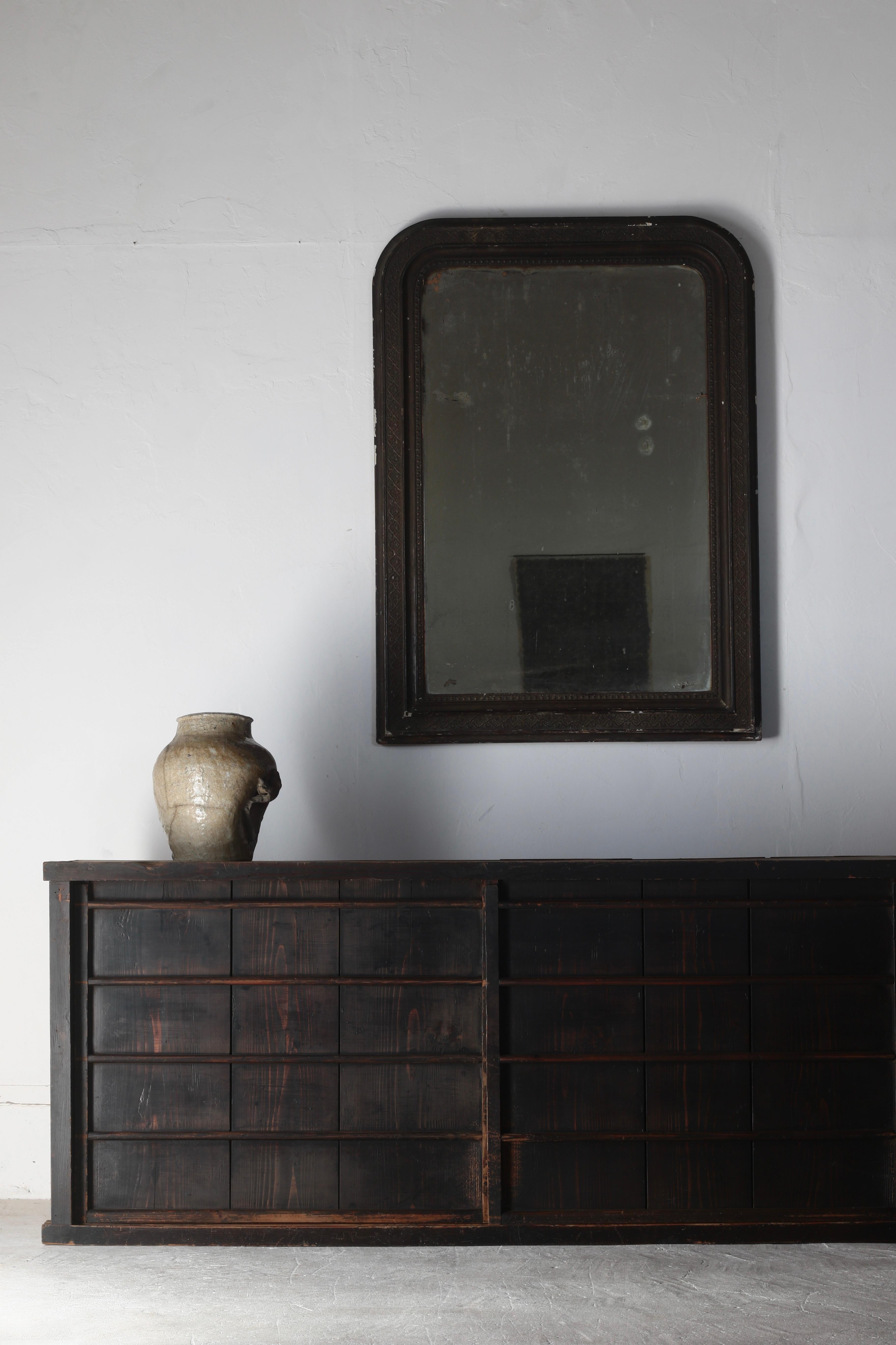 This is an old Japanese-made black mirror.

The back is inscribed with the date 