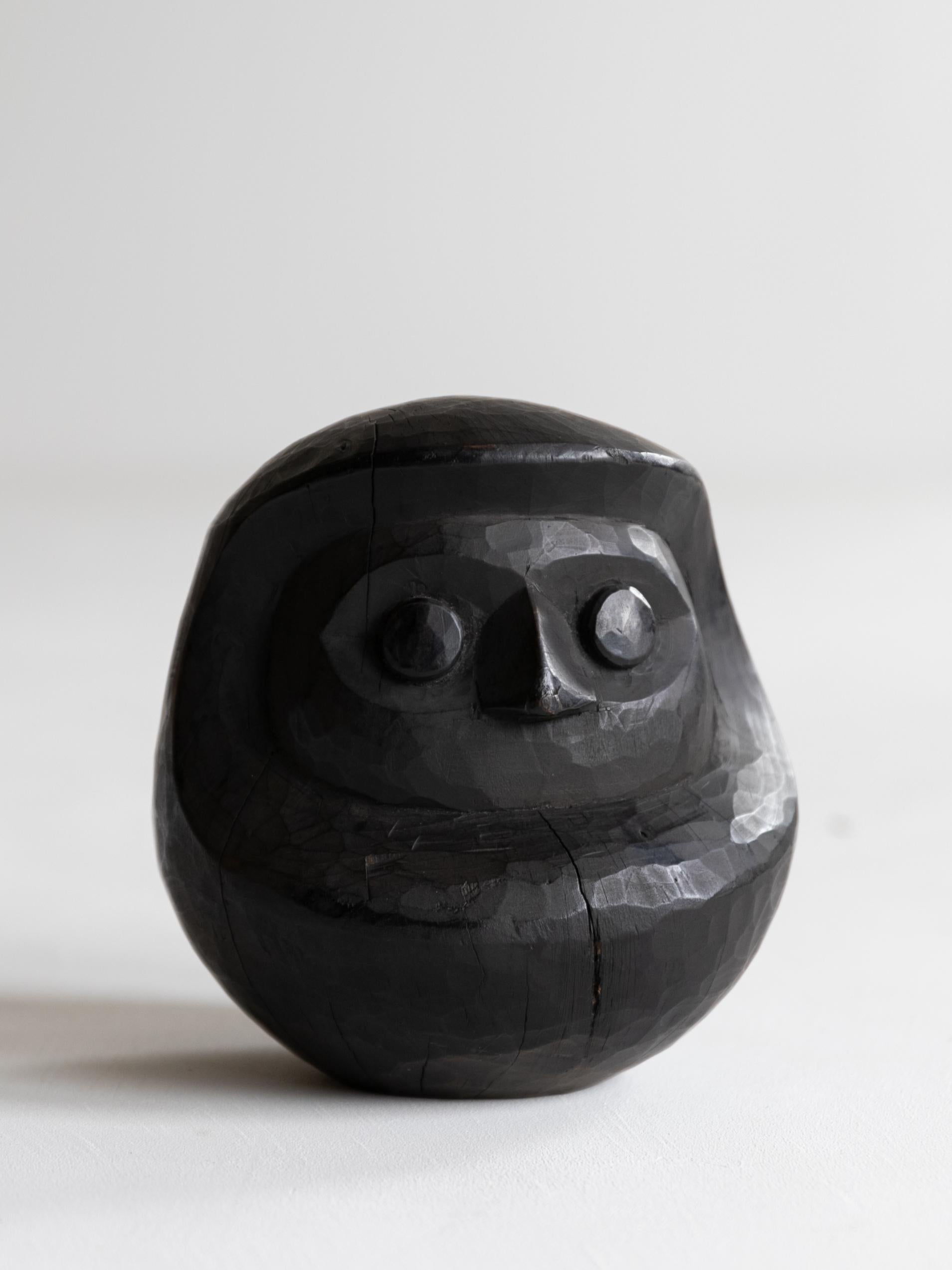This is an old Japanese large wooden Daruma.
It is from the Meiji period (1860s-1920s).
It is made from a large cedar tree.
It is rustic and beautiful, with traces of hand-carving.

This large size is very rare
This Daruma is a papier-mache