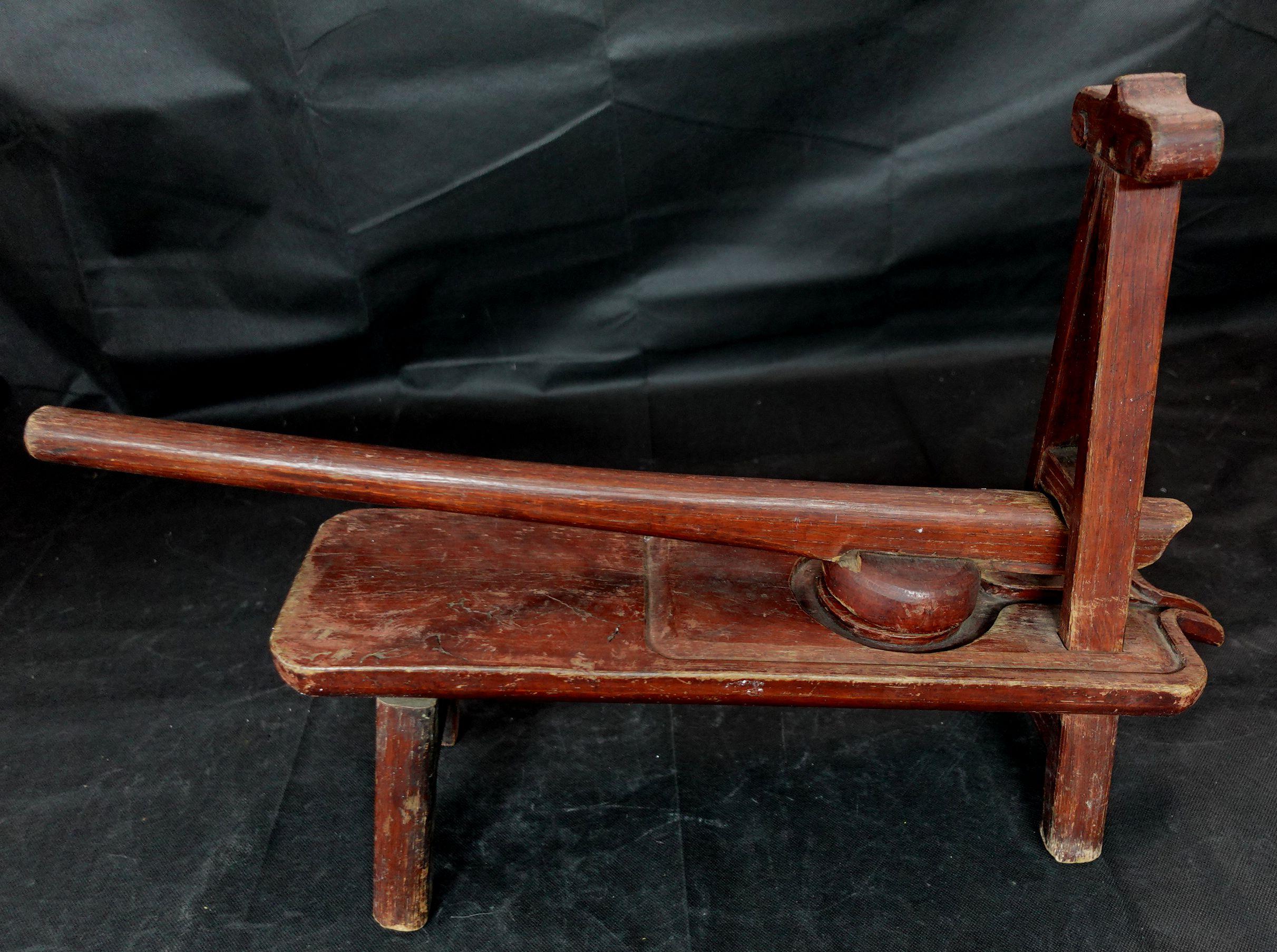 Japanese made entirely from wood, this antique was used mainly as a juicer for fruits. 
L:25in(63.5cm) H:16in(40.6cm).