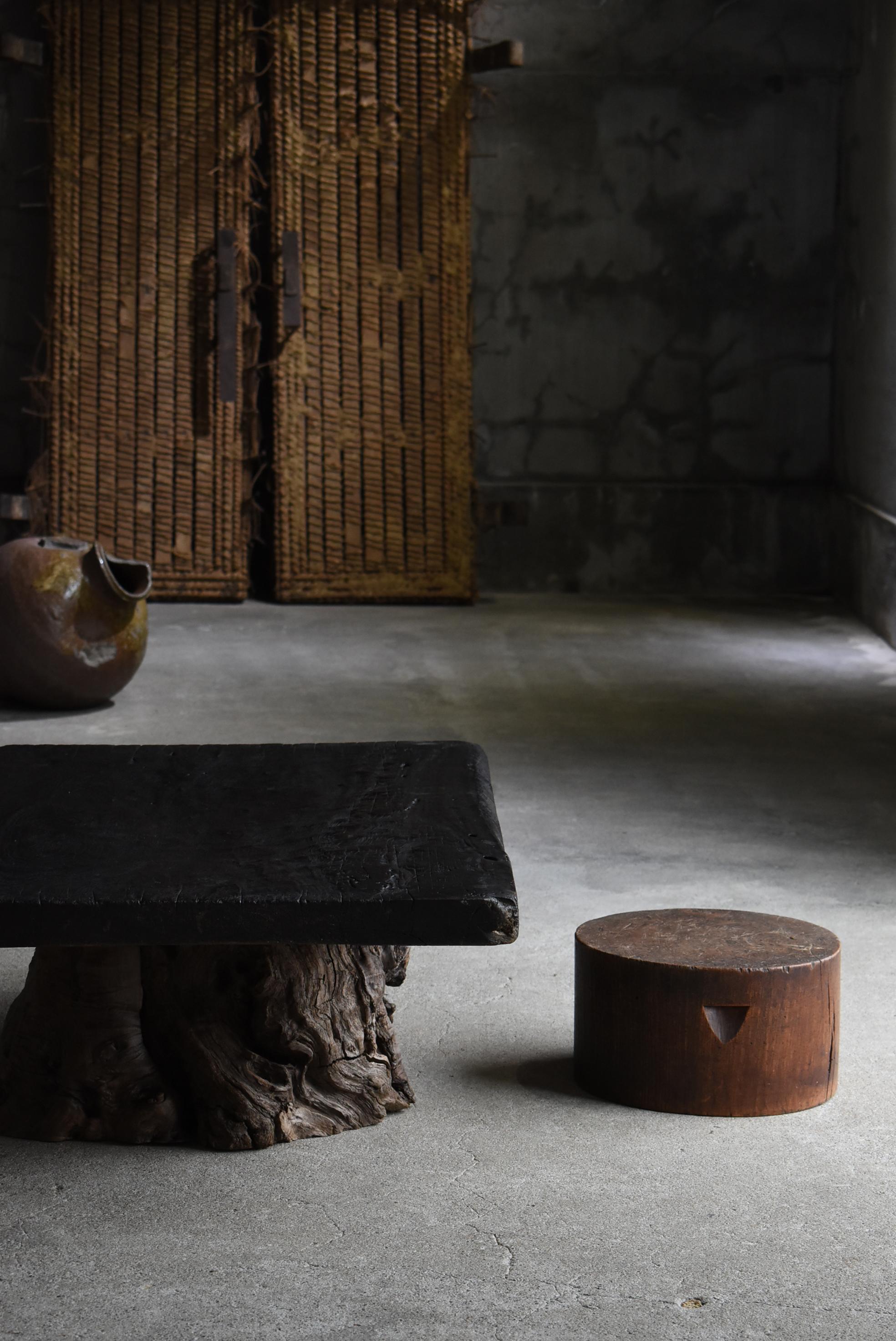 This is a very old Japanese wooden block stool.
It is from the Meiji period (1860s-1900s).
The material is zelkova wood.
It is hard and heavy wood.
The weight is 10 kg.

It is sturdy and stable.

The carved handle makes it easy to move.

It is