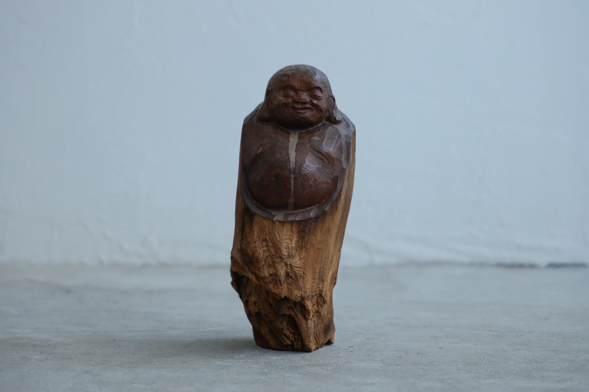 This is a wooden figurine from the Taisho period.

