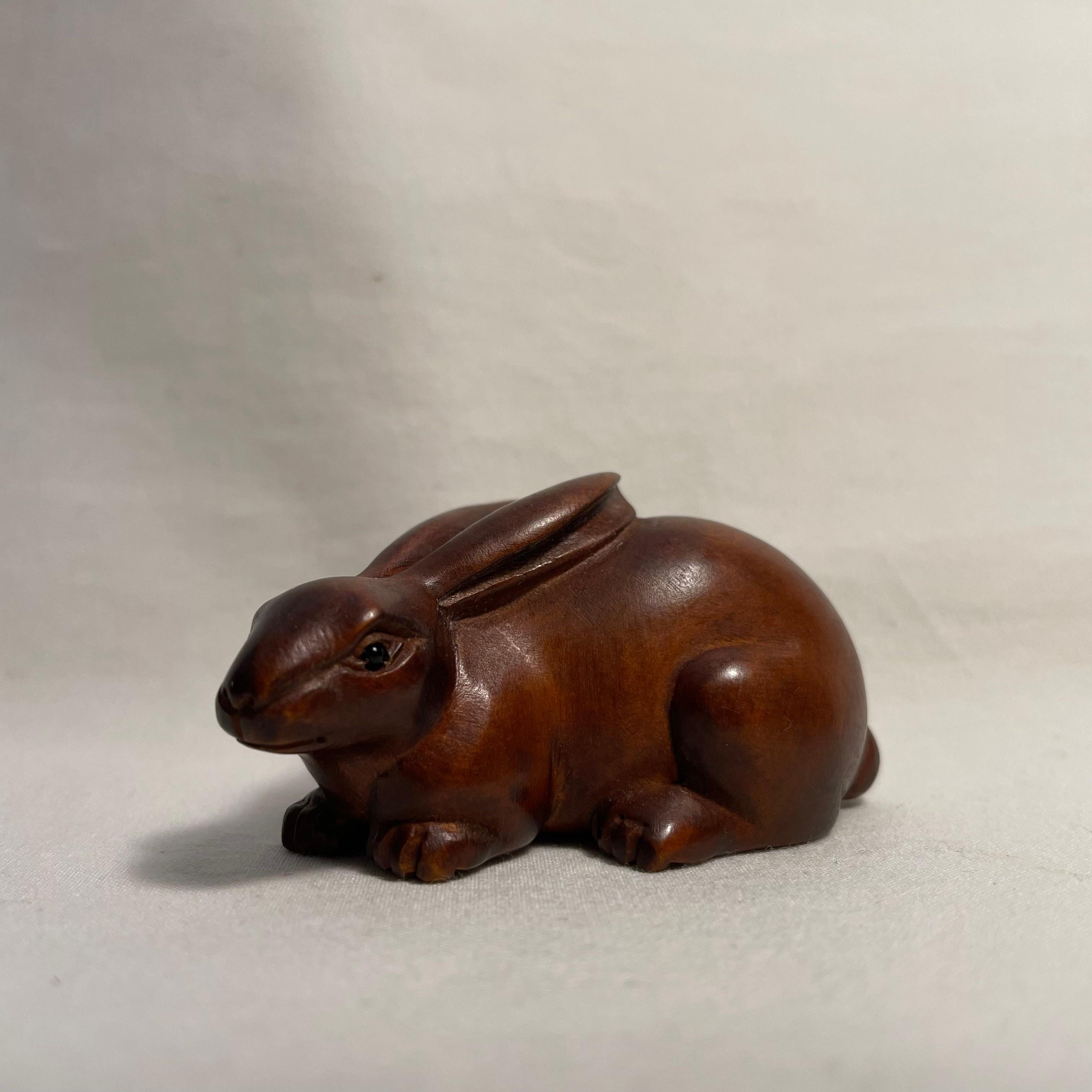 This is an antique wooden netsuke made in Japan around Taisho period 1920s.

Netsuke is a miniature sculpture, originating in 17th century Japan.
Initially a simply-carved button fastener on the cords of an inro box, netsuke later developed into