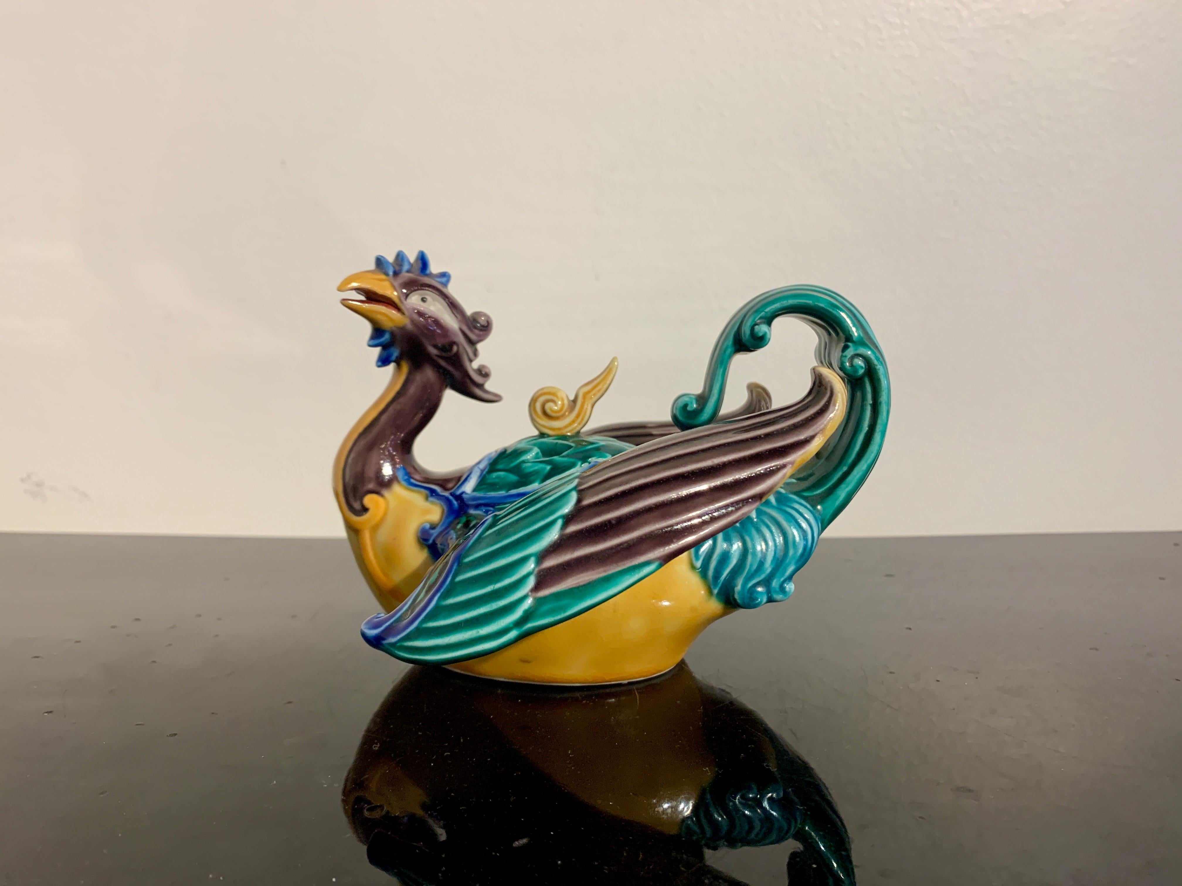 A fantastic Japanese Aote type Kutani incense burner, koro, in the form a phoenix, Showa era, circa 1930's, Japan.

The censer, koro, gracefully modeled as a phoenix in flight, and glazed in bold and bright green, yellow, aubergine and blue