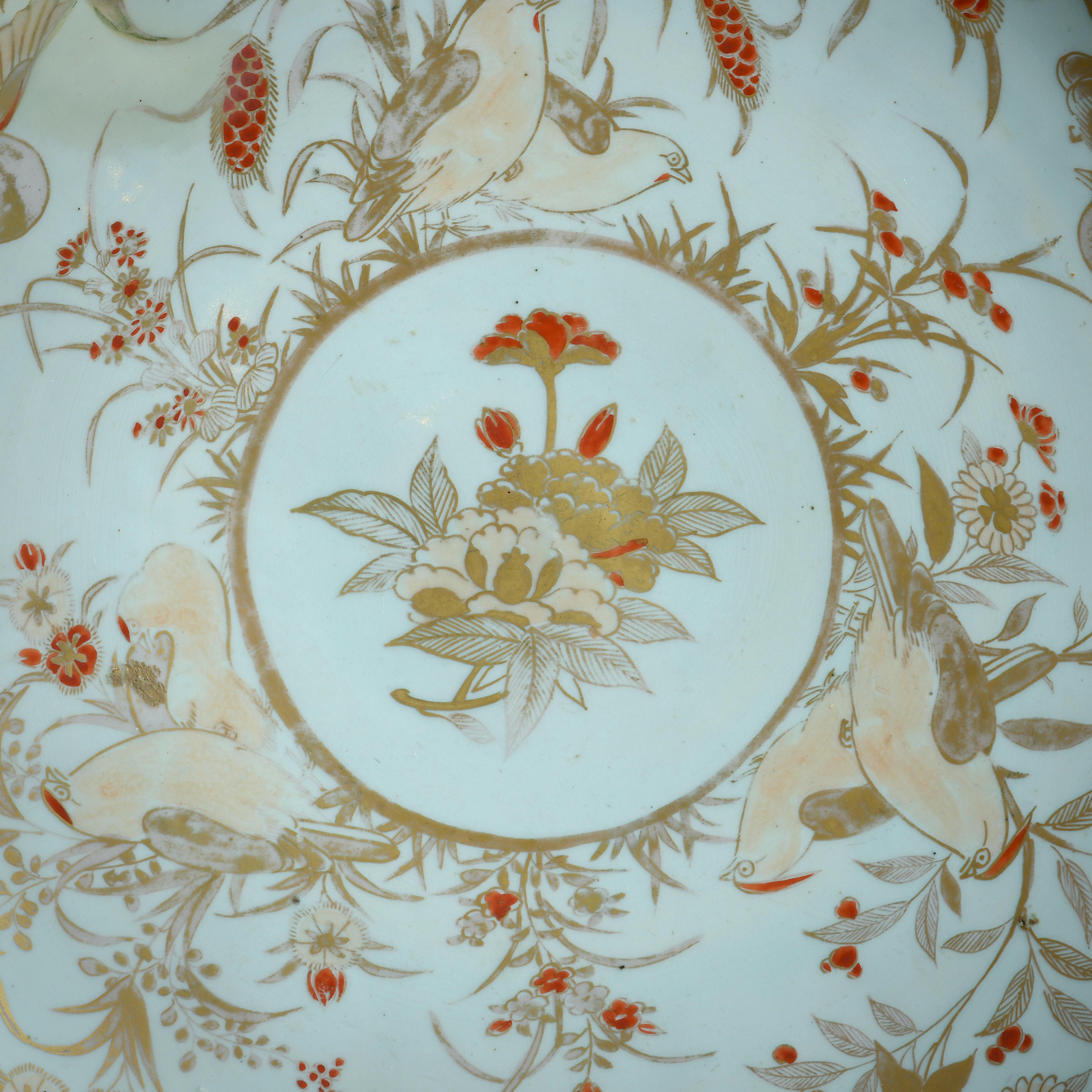 A FINE JAPANESE ARITA CHARGER RICHLY DECORATED IN IRON-RED, PINK AND GILT WITH BIRDS AND FLOWERS, Circa 1700.