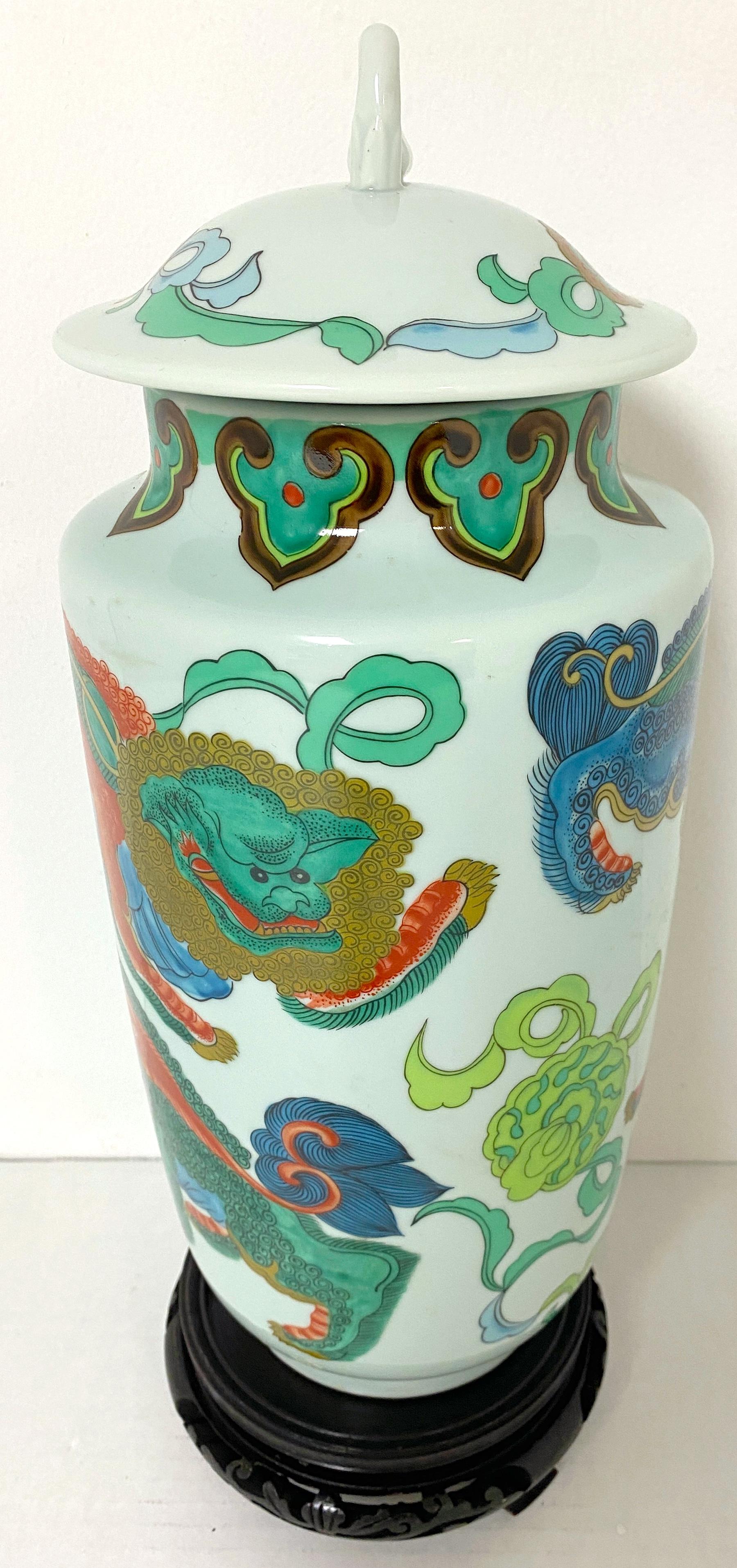 Porcelain Japanese Arita Foo dog Motif Covered Urn, with Carved Hardwood Stand  For Sale