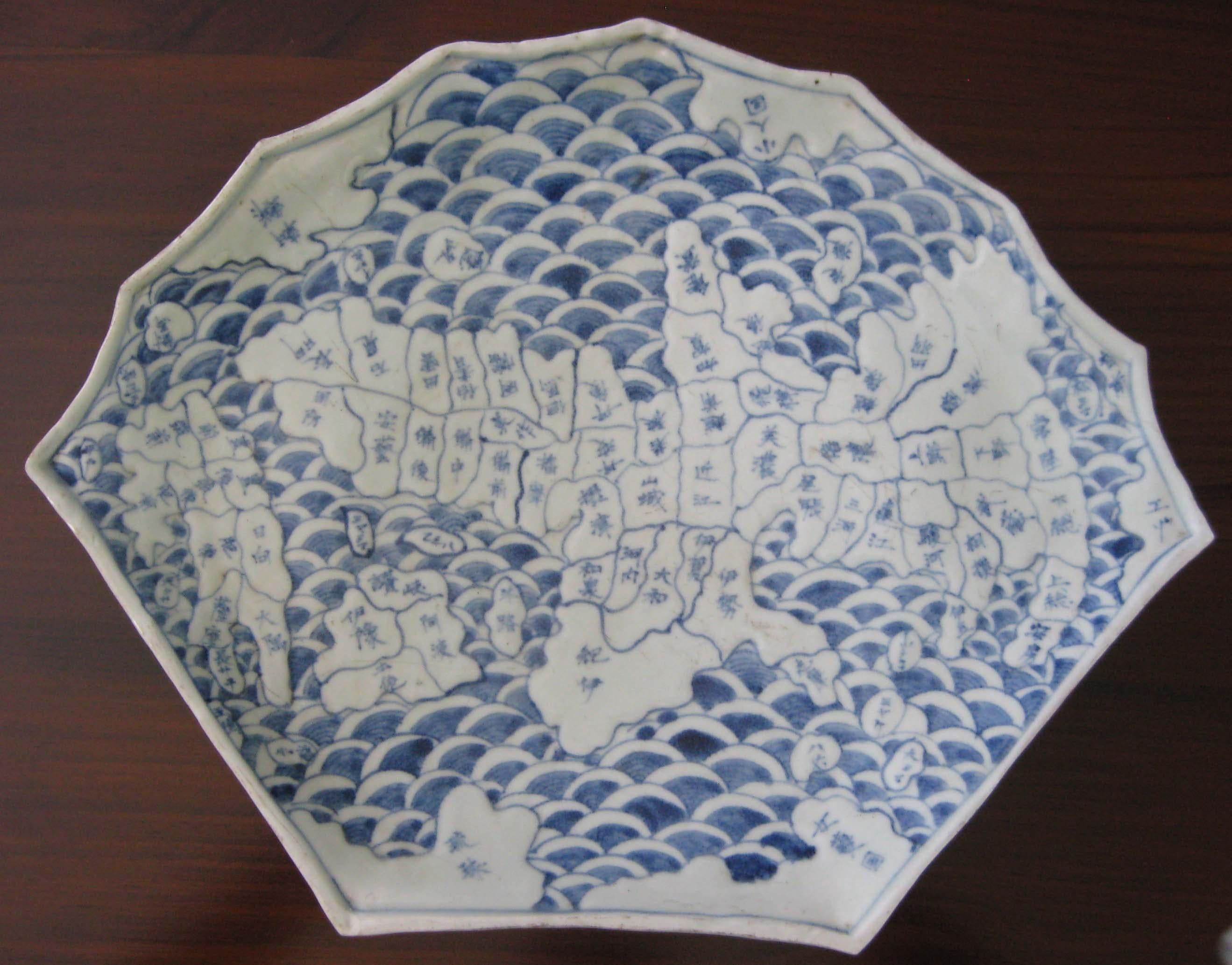 This fan shape is a rare design for a map dish and it is a relatively large example, width 42cm.

In Arita, map dishes were made in abundance from around the tempo period (1830-1844) to the end of the Edo era (1615-1868). However, few examples