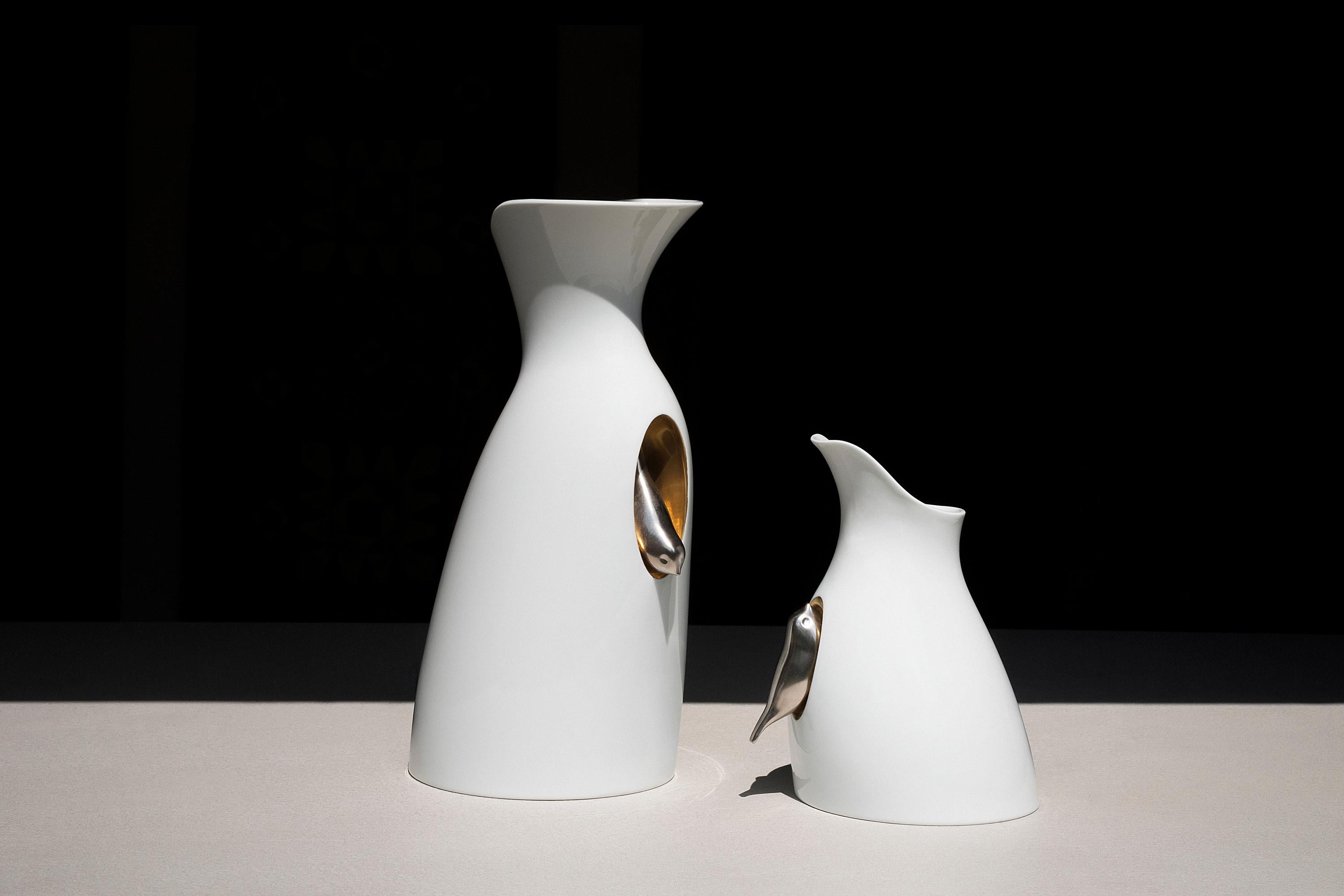 This poetic carafe is designed by GumDesign and handmade in Japan by Risogama for Hands on Design, a traditional pottery. It's characterized by a small silver bird that seems to take refuge in a golden nest carved into the material. The spout for