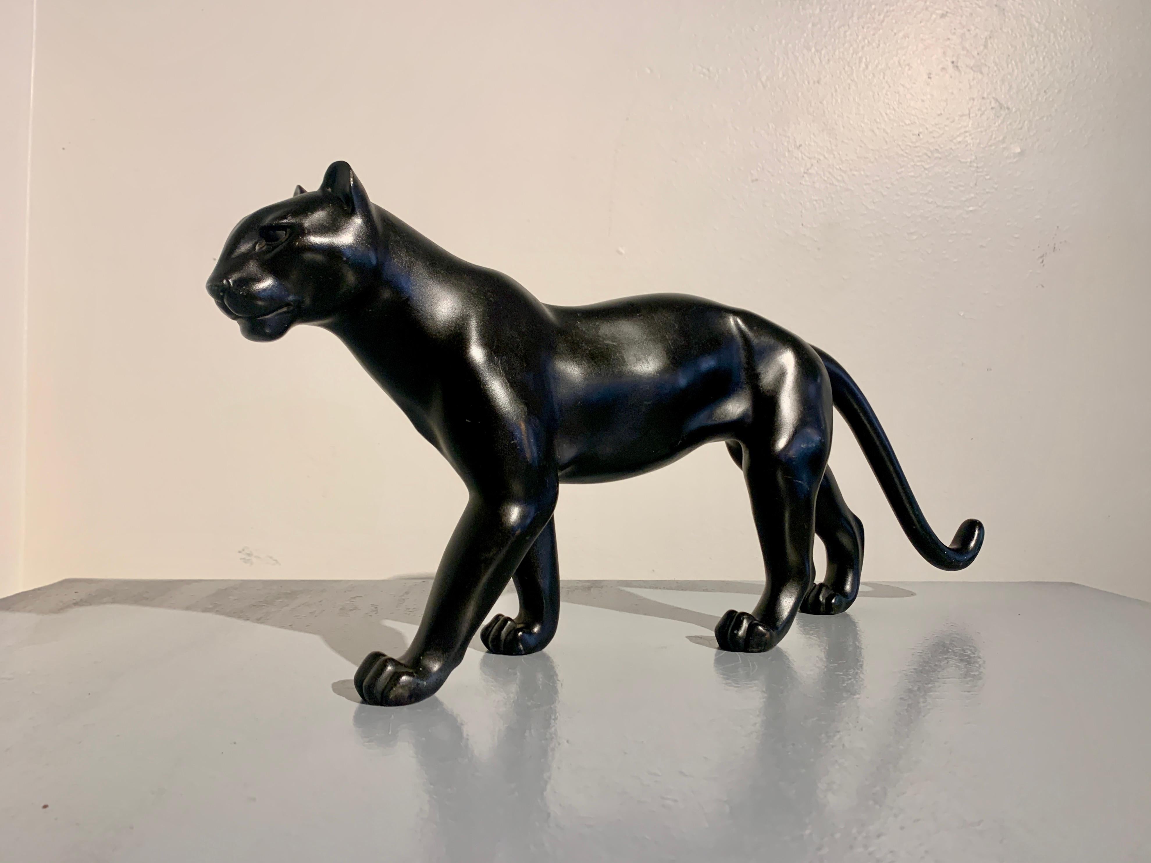 A striking and elegant Japanese Art Deco cast and patinated bronze model of a walking male panther, signed Yukiyoshi, Showa Era, circa 1930's, Japan.

The dignified feline portrayed in a walking pose, with a beautiful sense of motion. The panther's