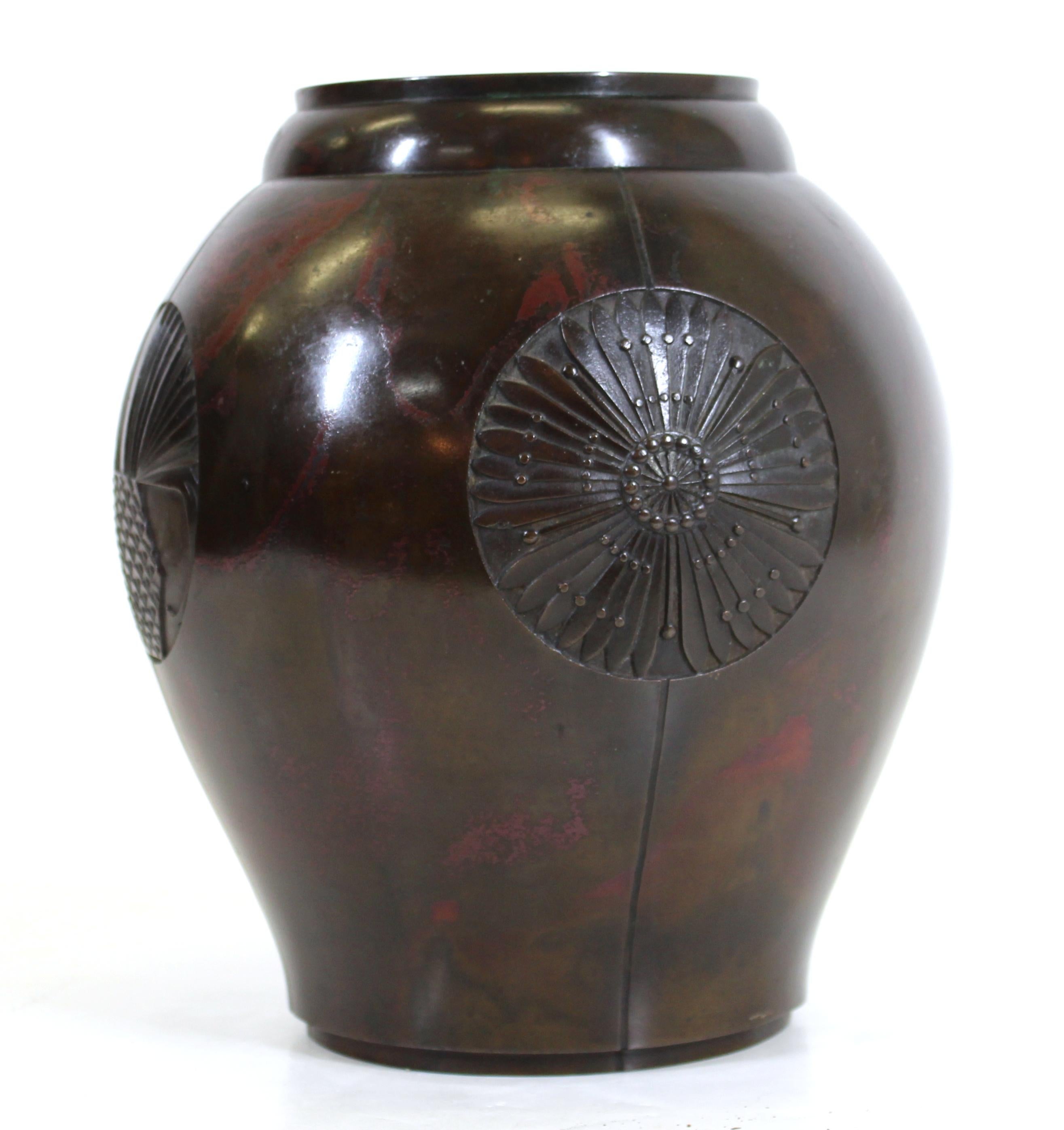 Japanese Art Deco period rare four seasons bronze vase with individual medallions depicting the four seasons, with a rare red swirled through brown patina.