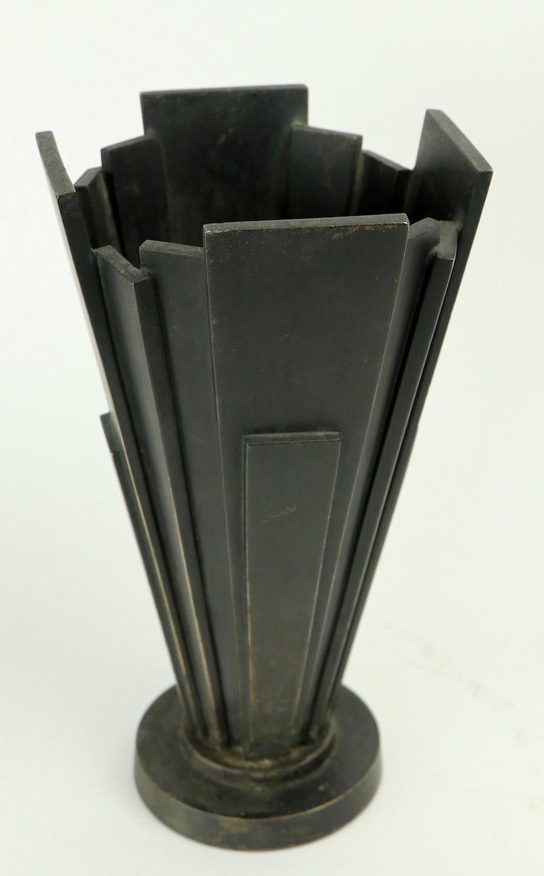 Rare and unusual Futurist style bronze vase made in Japan. Dramatic tapering dimensional rectangle surface, on stepped disk form circular base, marked JAPAN on base. Examples of modernist design from Japan are not often seen on the market. Nice