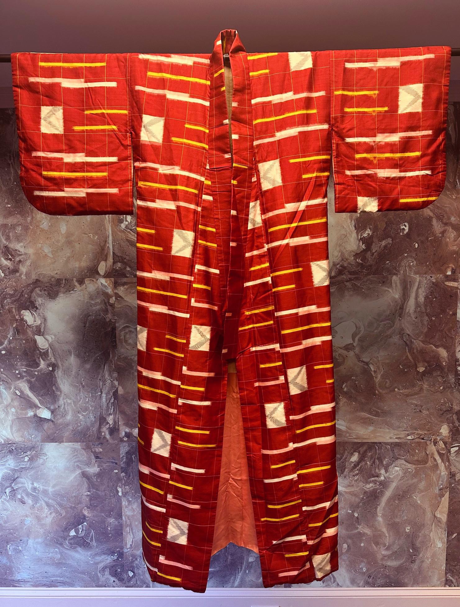 A striking and well preserved Japanese Meisen kimono hand-sewn from woven Ikat Silk circa 1920-40s (Taisho to Showa period). The kosode style kimono (small sleeve), with its Art Deco woven pattern, was a great example of the high end Meisen silk