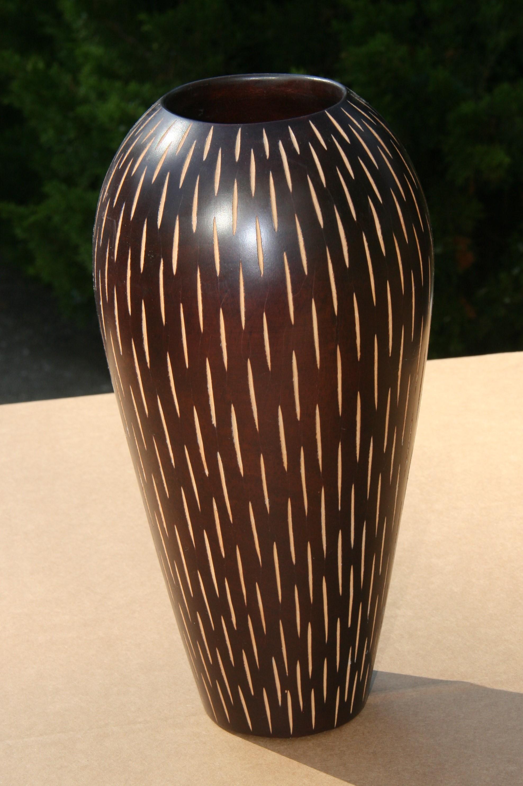 1887 Japanese Deco style hand turned wood vase with vertical slits.