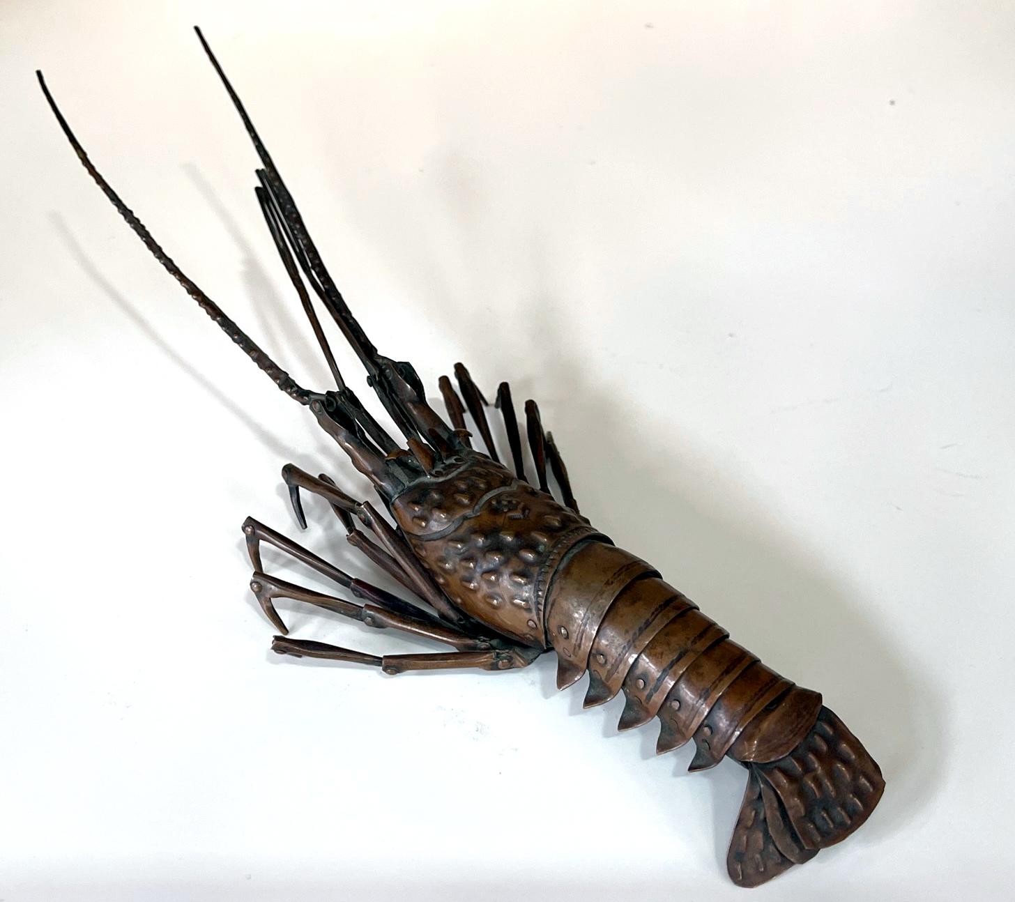 An articulate spiny lobster (Ise-Ebi) as an ornamental display item, known in Japanese as Jizai Okimono, was made by Myochin Hiroyoshi in the late Meiji Period circa 1890-1900s. The lobster was meticulously constructed in life-size with copper or a