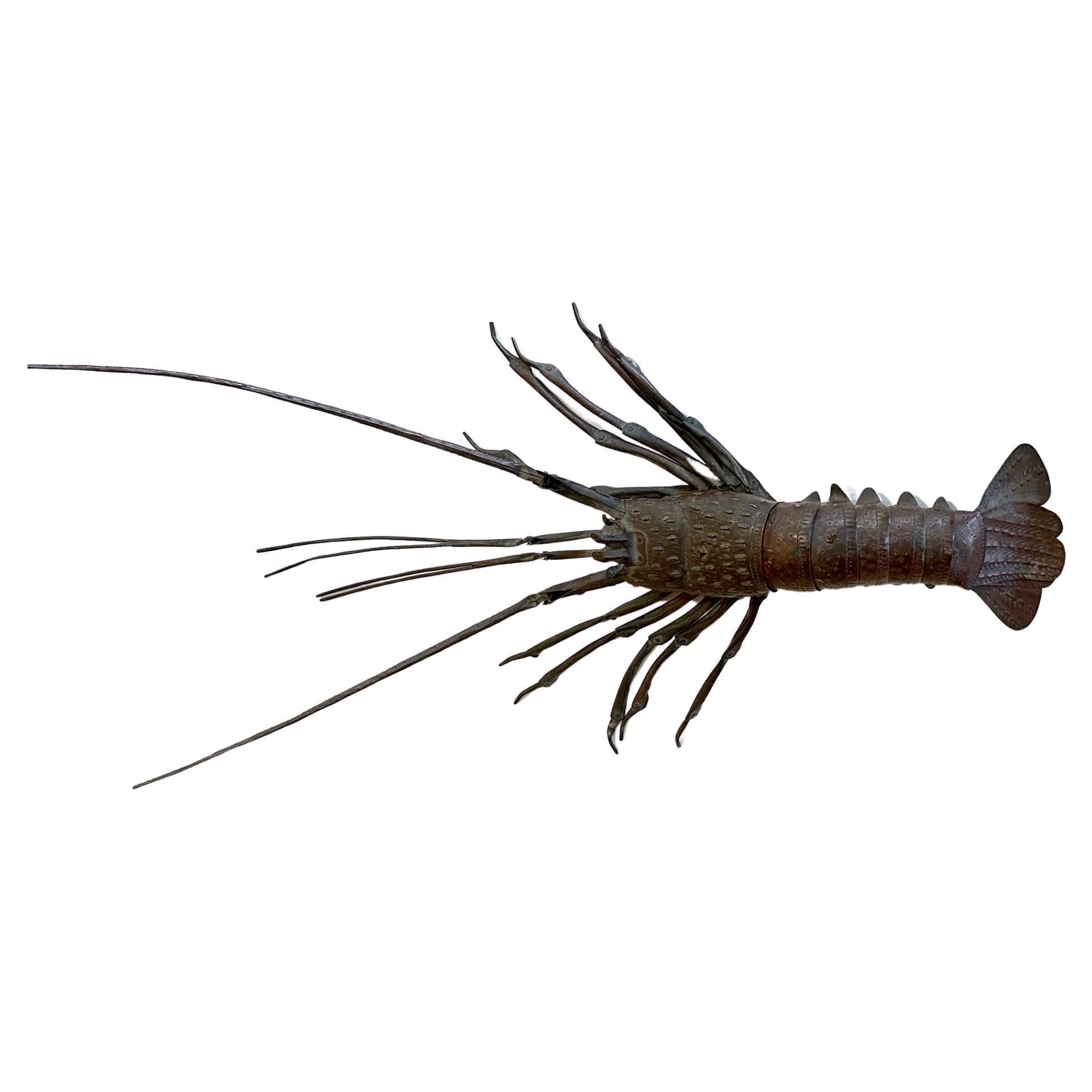 An articulate spiny lobster (Ise-Ebi) as an ornamental display item, known in Japanese as Jizai Okimono, was made by Myochin Hiroyoshi in the late Meiji Period circa 1890-1900s. The lobster was meticulously constructed in life-size with copper or a