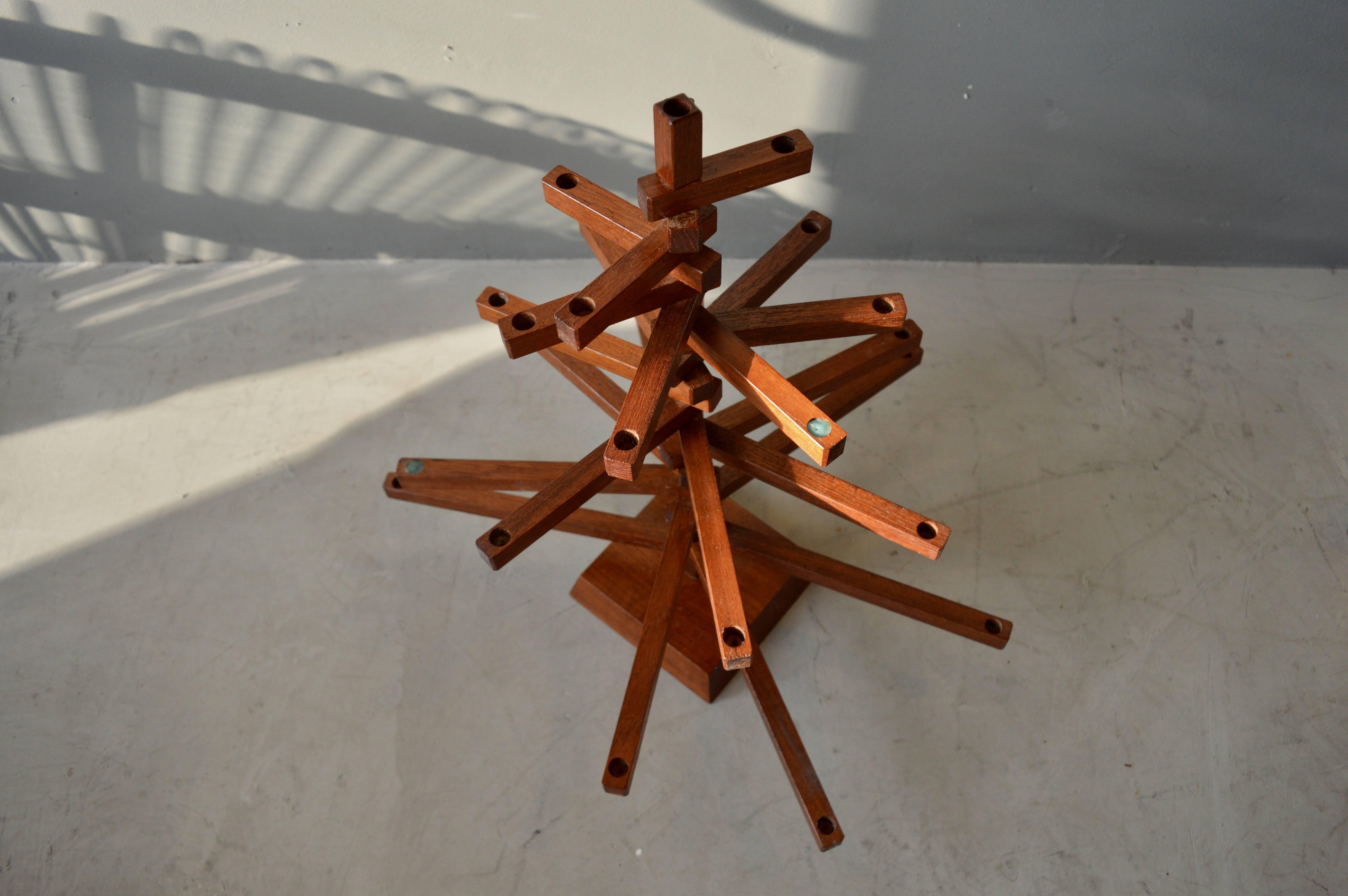 Very unique wood candelabra from Japan. Each arm rotates 360 degrees. 22 arms. 23 places to place a candle. Great design. Excellent condition.