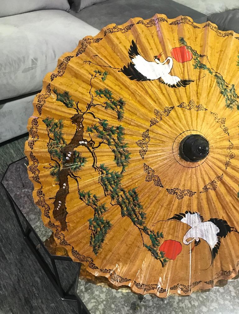 A gorgeous hand painted Japanese parasol (wagasa), beautifully decorated with vibrant colors and delicately constructed with washi paper and bamboo. Featuring two cranes in flight.

A nice accent piece. 

Dimensions expanded: 24